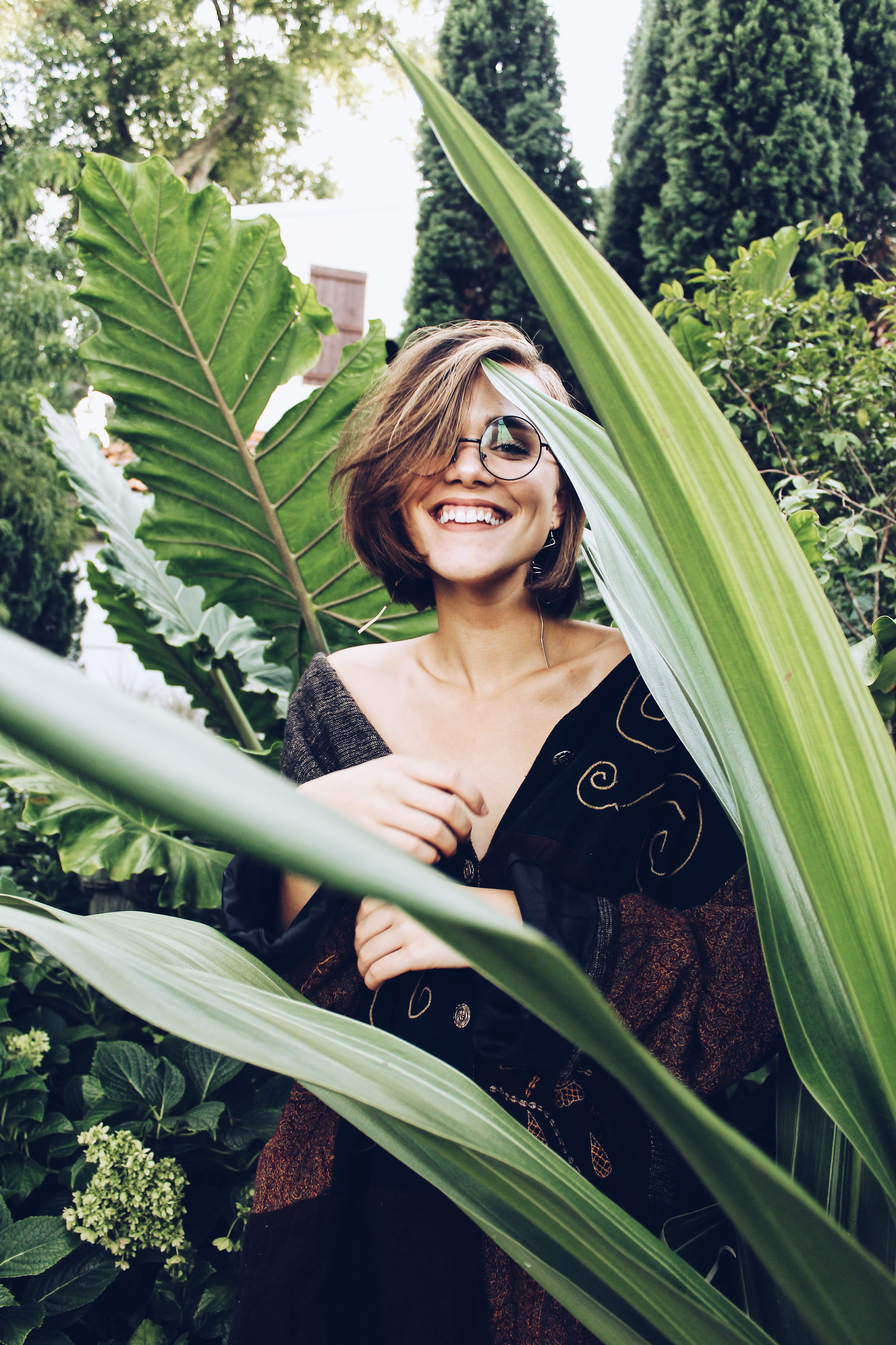 fir, female, hairstyle, leaf, standing, happiness, leisure activity, trees, potted plant, flora, ornament, fractal, vine, beside, beautiful woman, pottery, Phone HD Wallpaper