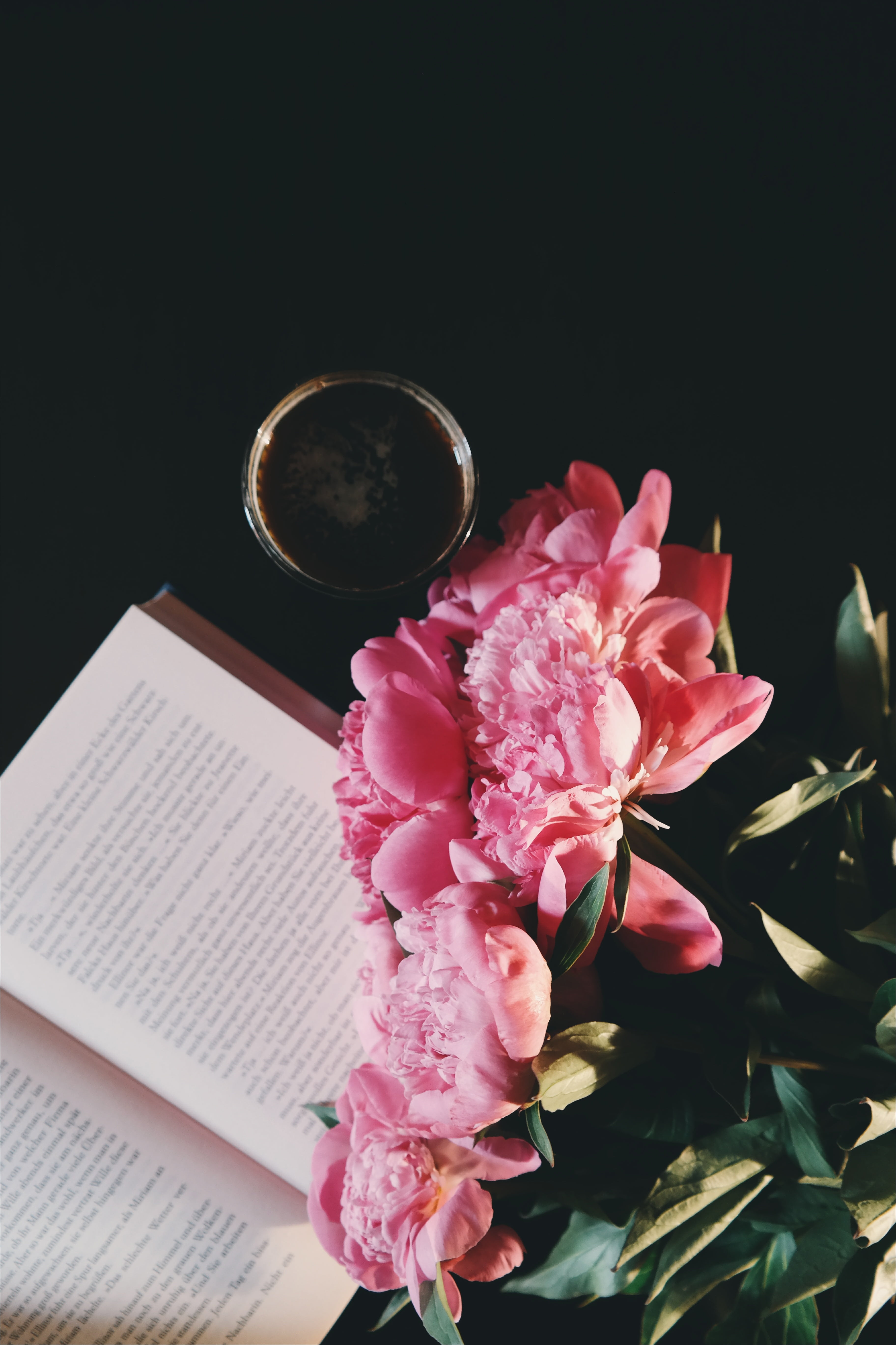peonies, drinks, petal, publication, book, reading, pink color, vulnerability, books, paper, black table, freshness, close-up, nature, flowering plant, Phone HD Wallpaper