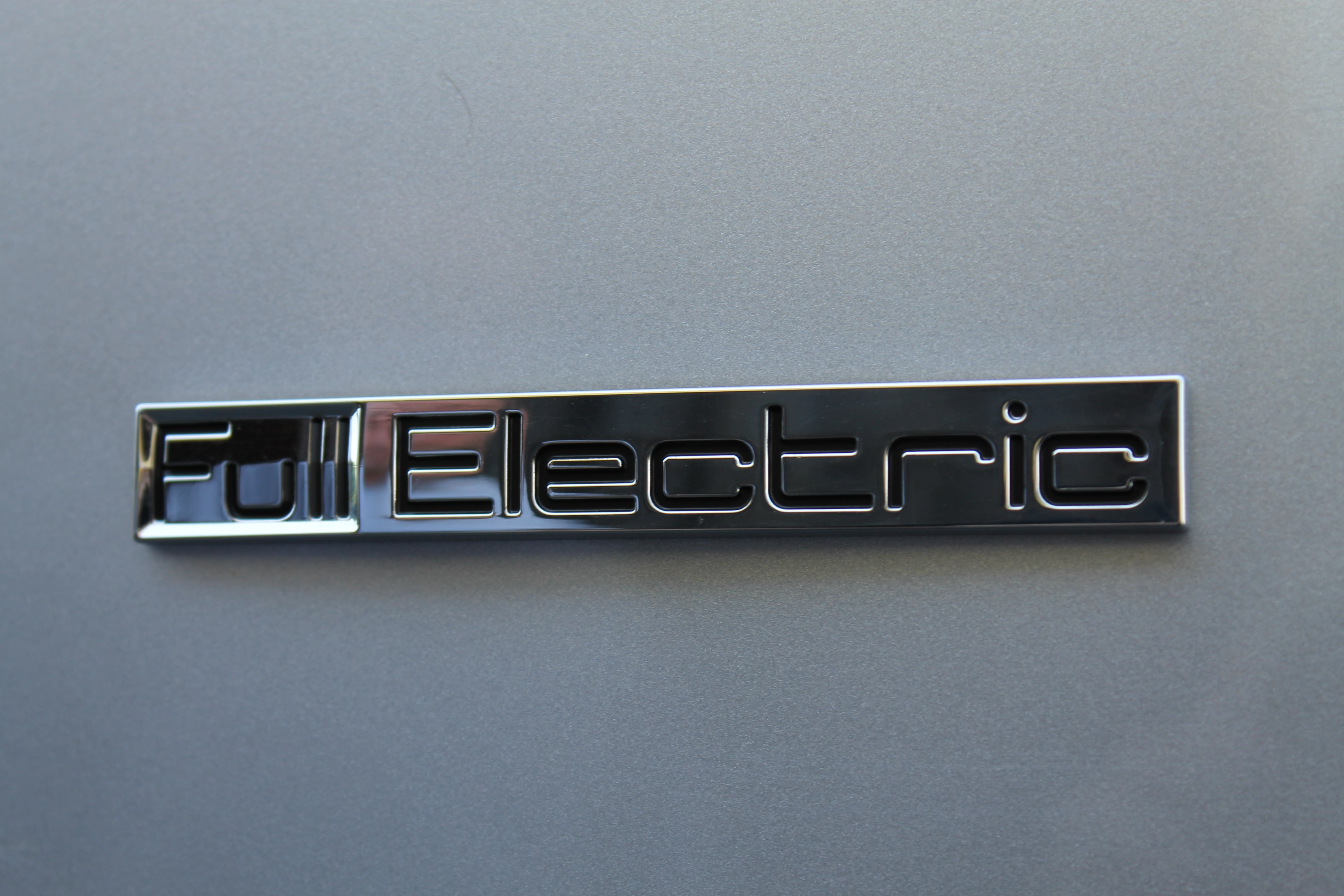 electric car, sign, high angle view, western script, copy space, e car, ecology, architecture, wall - building feature, electricity, text, auto, capital letter, HD Wallpaper