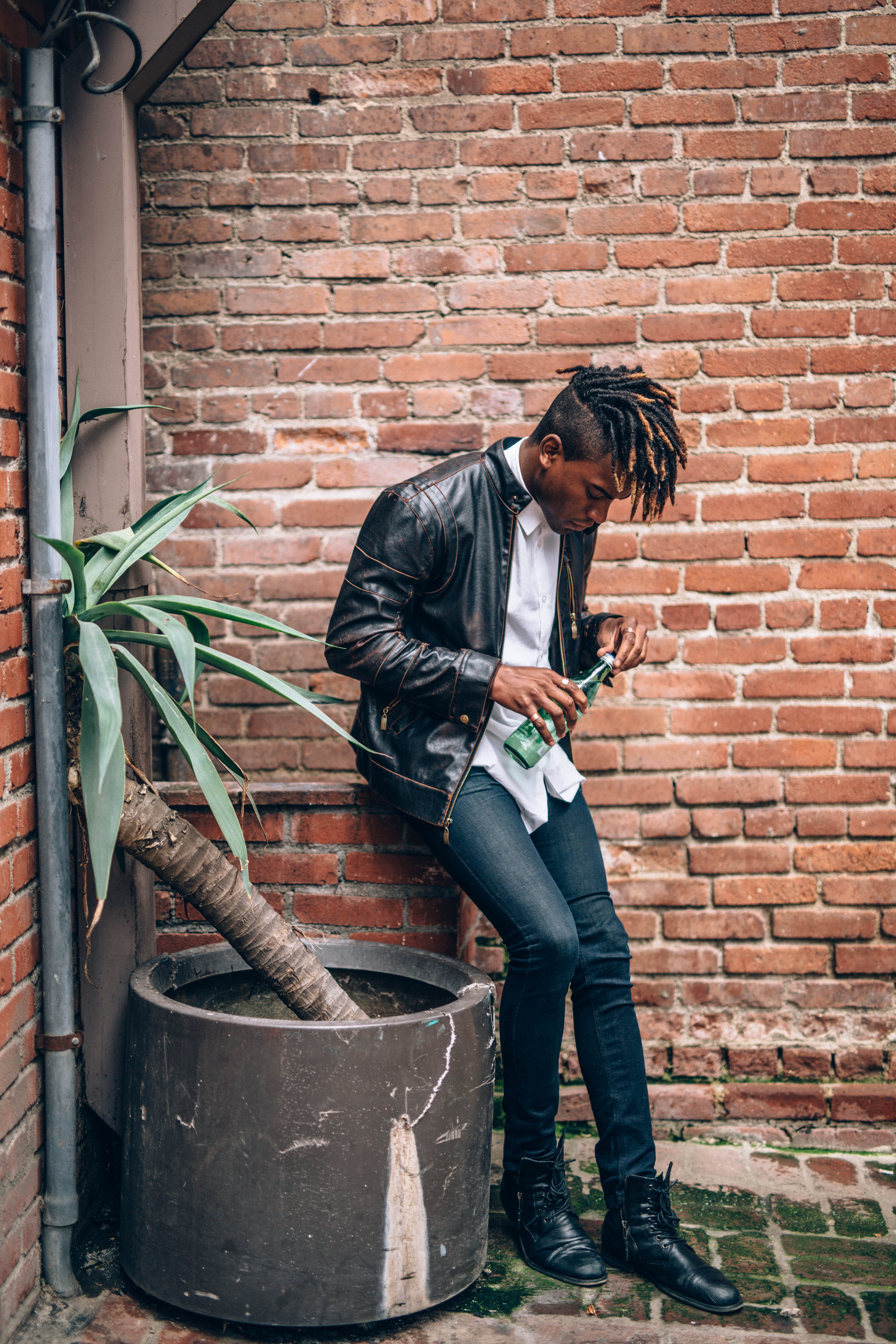 casual clothing, social issues, bricked, leather jacket, bottle, lifestyles, full length, one person, brick, side view, poc, architecture, clothing, green, Phone HD Wallpaper