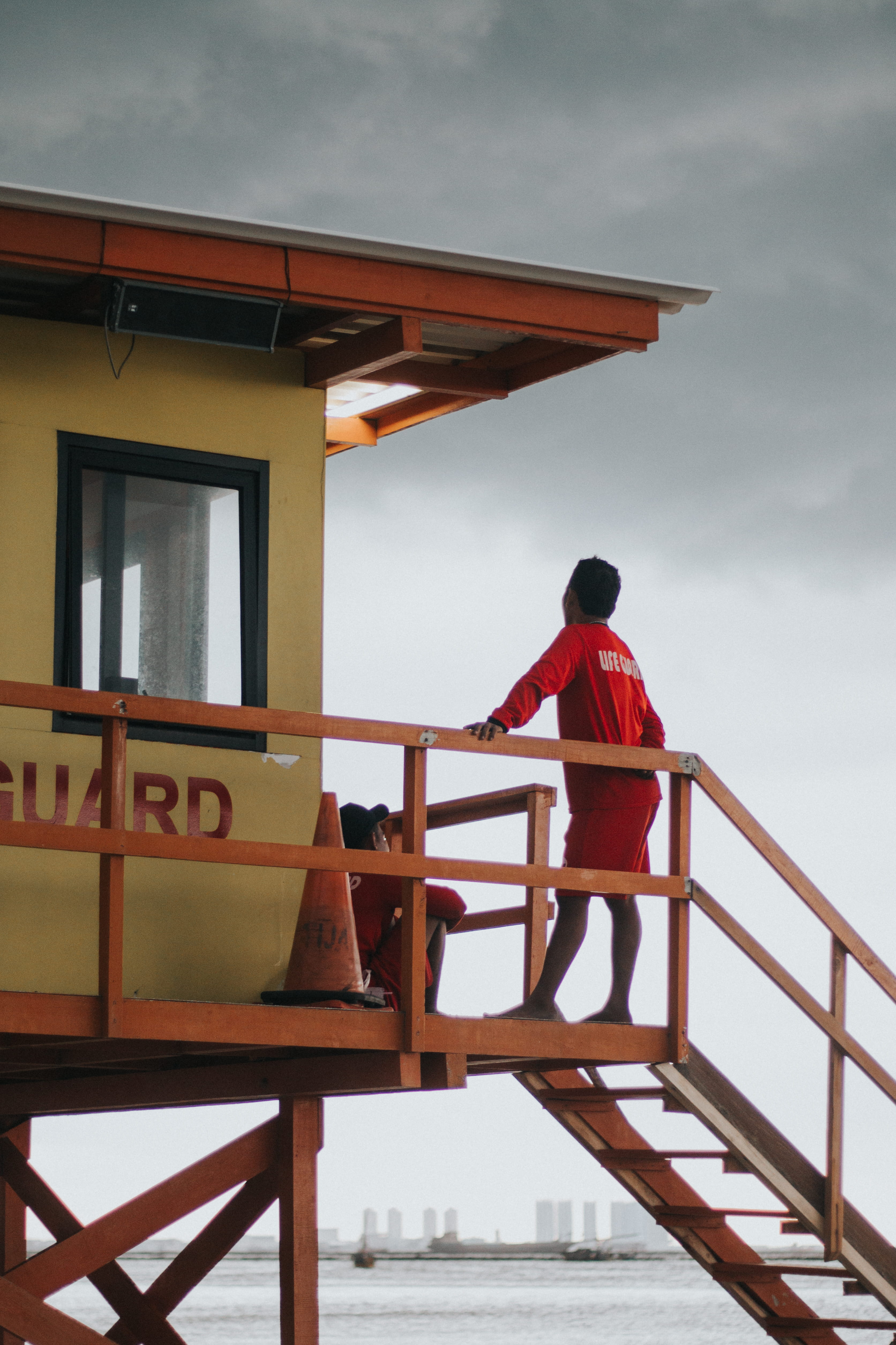 guard, architecture, one person, dufan, lifeguard, sky, rear view, built structure, people, seat, railing, baywatch, leisure activity, building exterior, Phone HD Wallpaper