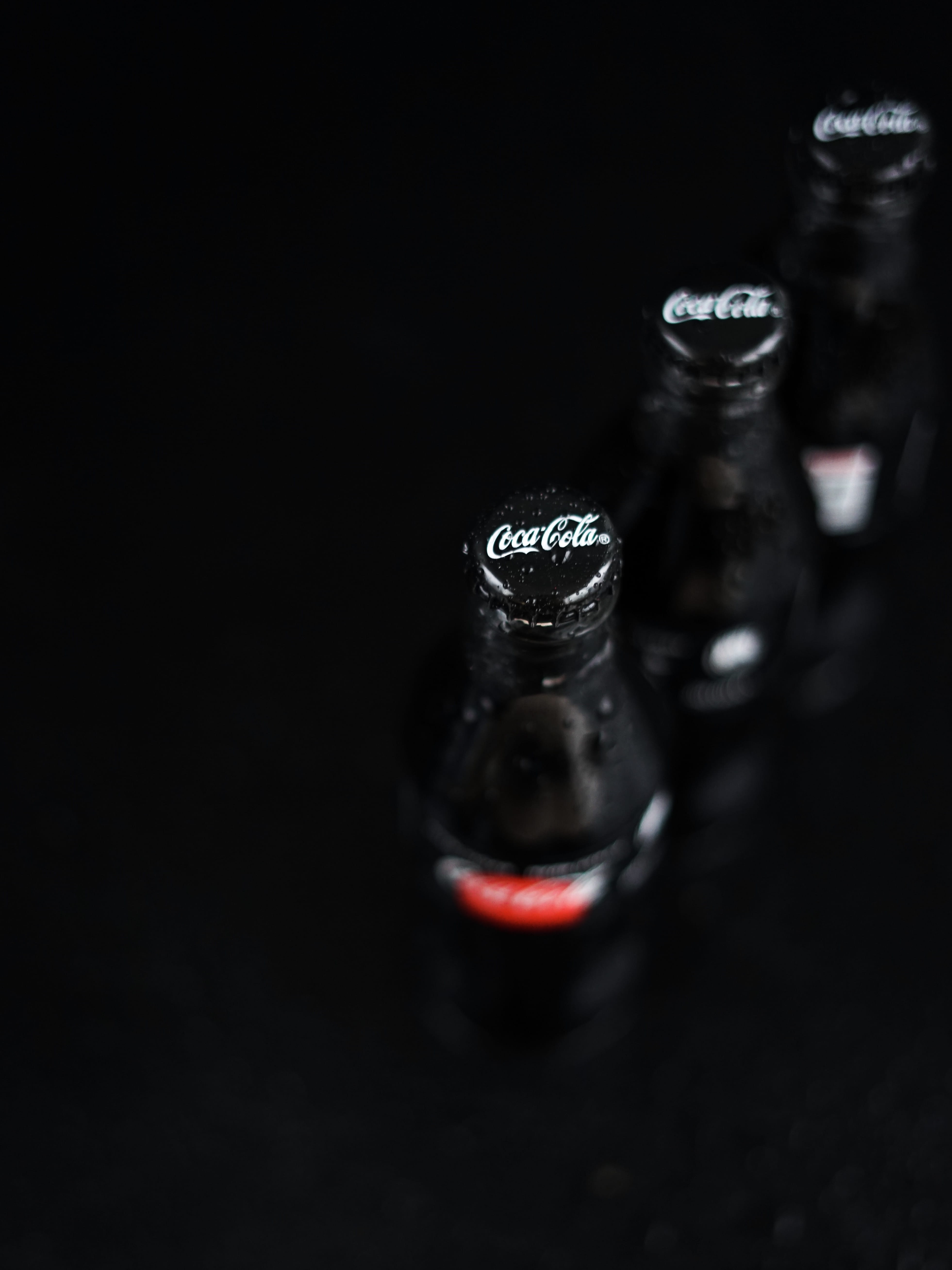 indoors, seasoning, still life, glass, studio shot, selective focus, three, cola, bottle, black background, 5K, coca, bottles, simplicity, black color, Phone HD Wallpaper