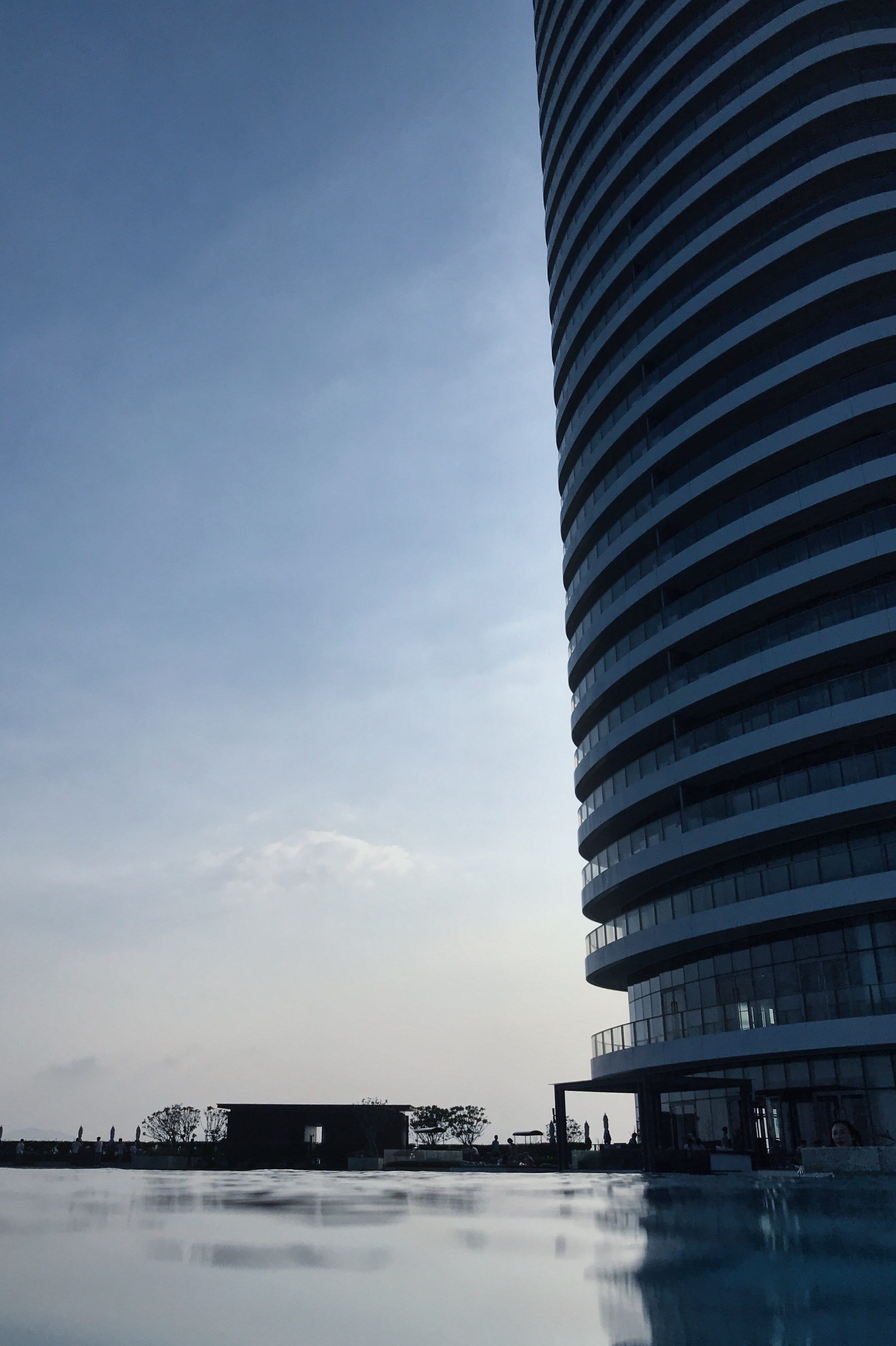 sky, city, 4K, outdoors, cityscape, pool, architecture, modern, copy space, infinity pool, skyscraper, cloud - sky, hotel, sanya, day, mode of transportation, Phone HD Wallpaper