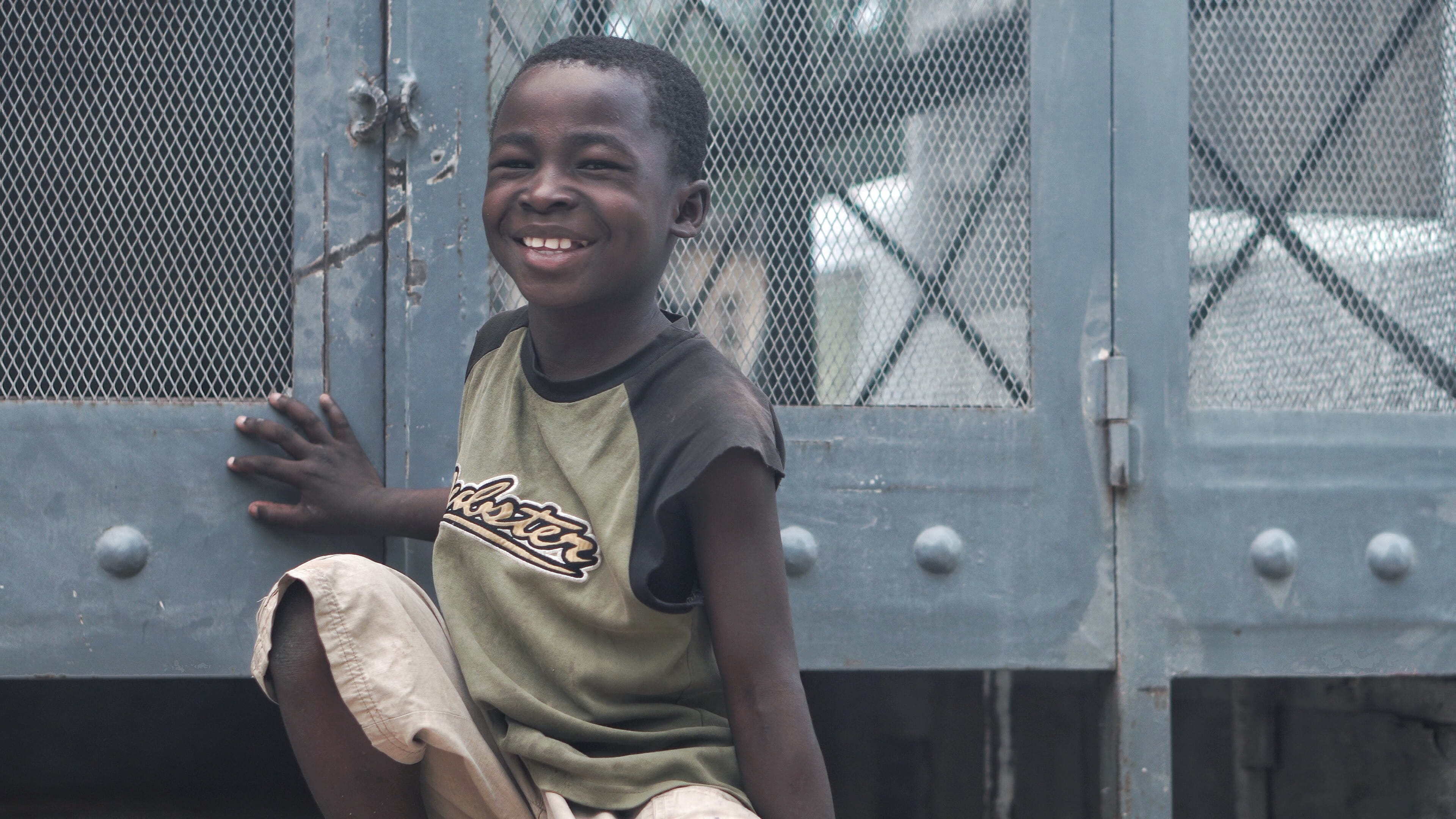 travel, boy, kid, men, child, front view, haiti, day, smile, smiling, outdoors, pants, truck, beside, casual clothing, hatian, pose, childhood, gray, black, HD Wallpaper