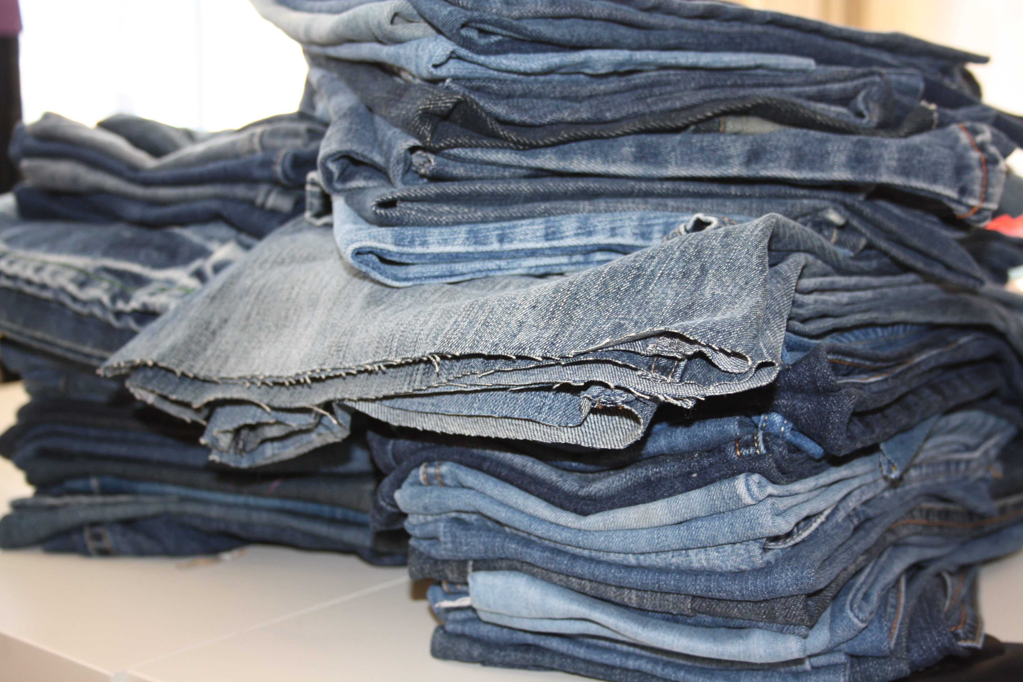 jeans, close-up, large group of objects, focus on foreground, 4K, old clothes, recycling, old, pile of jeans, arrangement, textile, casual clothing, no people, HD Wallpaper