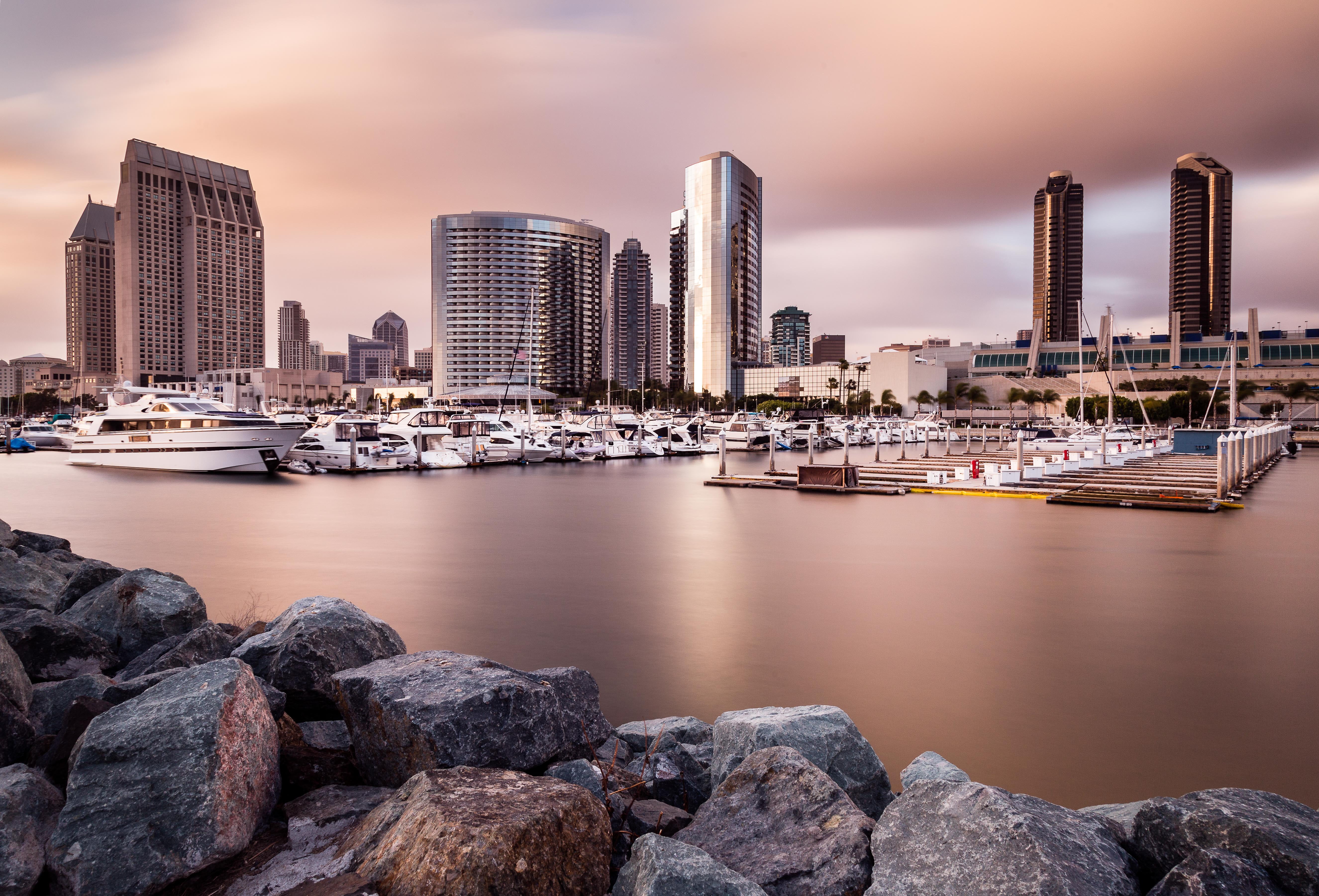 nautical Vessel, building, travel, sea, white, boat, urban Skyline, sunset, marina, harbor, concrete, Downtown San Diego, 5K, skyline, architecture, waterfront  city, HD Wallpaper