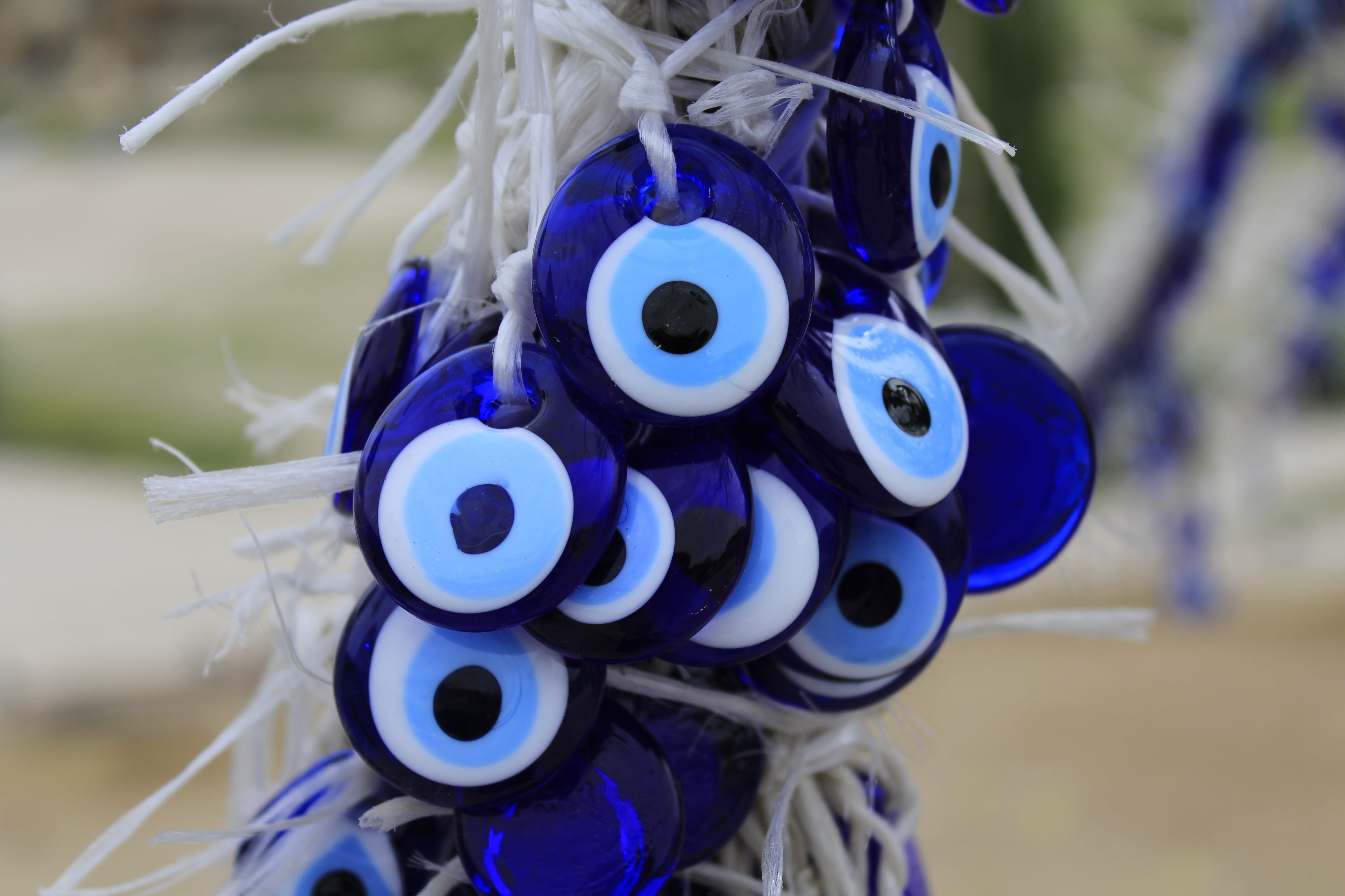 celebration, close-up, plastic, evil eye, superstitious, protection, glass, toy, security, no people, nature, amulet, culture, bead, still life, day, cobalt blue, HD Wallpaper