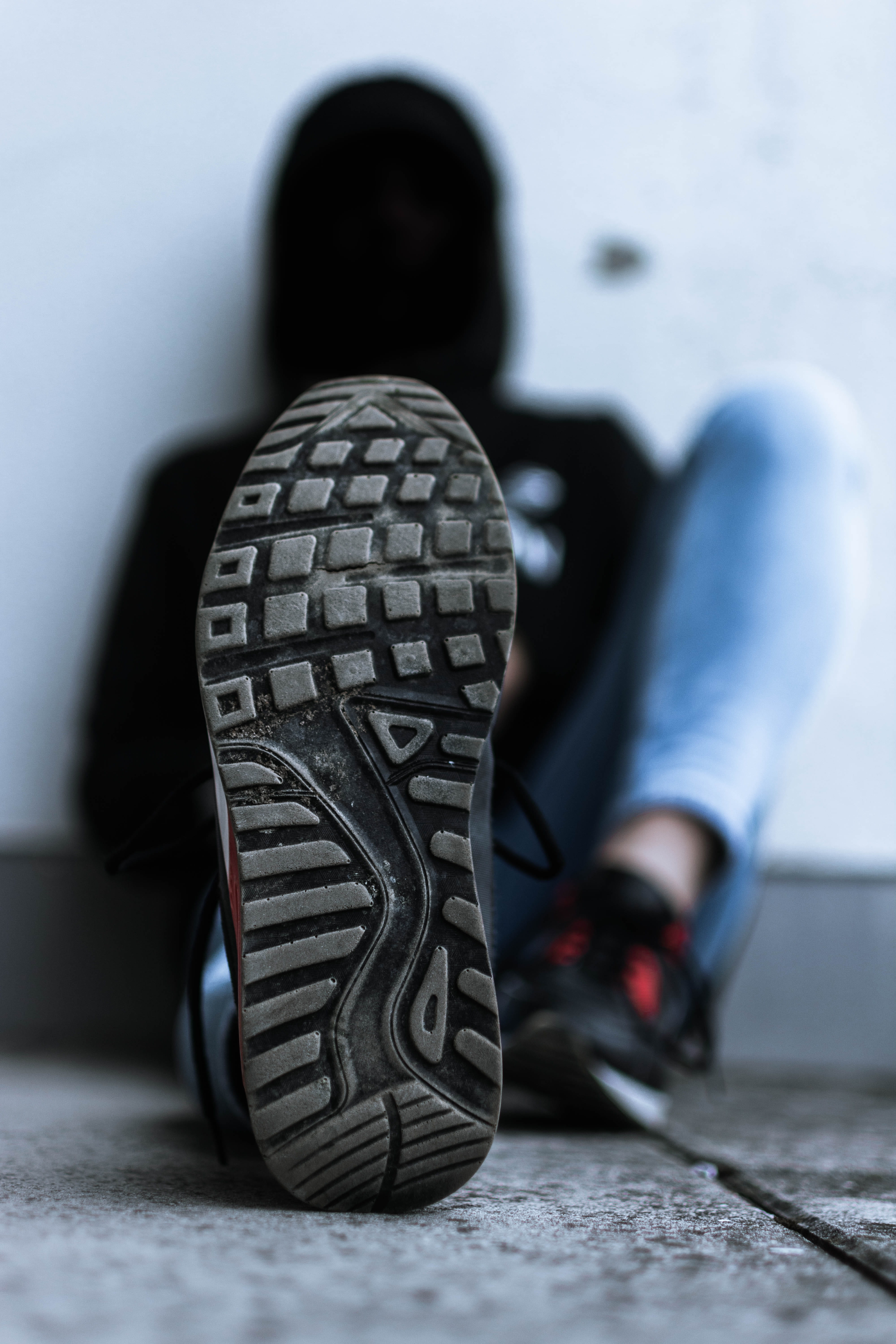 alloy wheel, sneaker, running shoe, covered, low section, leisure activity, sitting, sports equipment, streetphotography, casual clothing, black, wearing, Phone HD Wallpaper