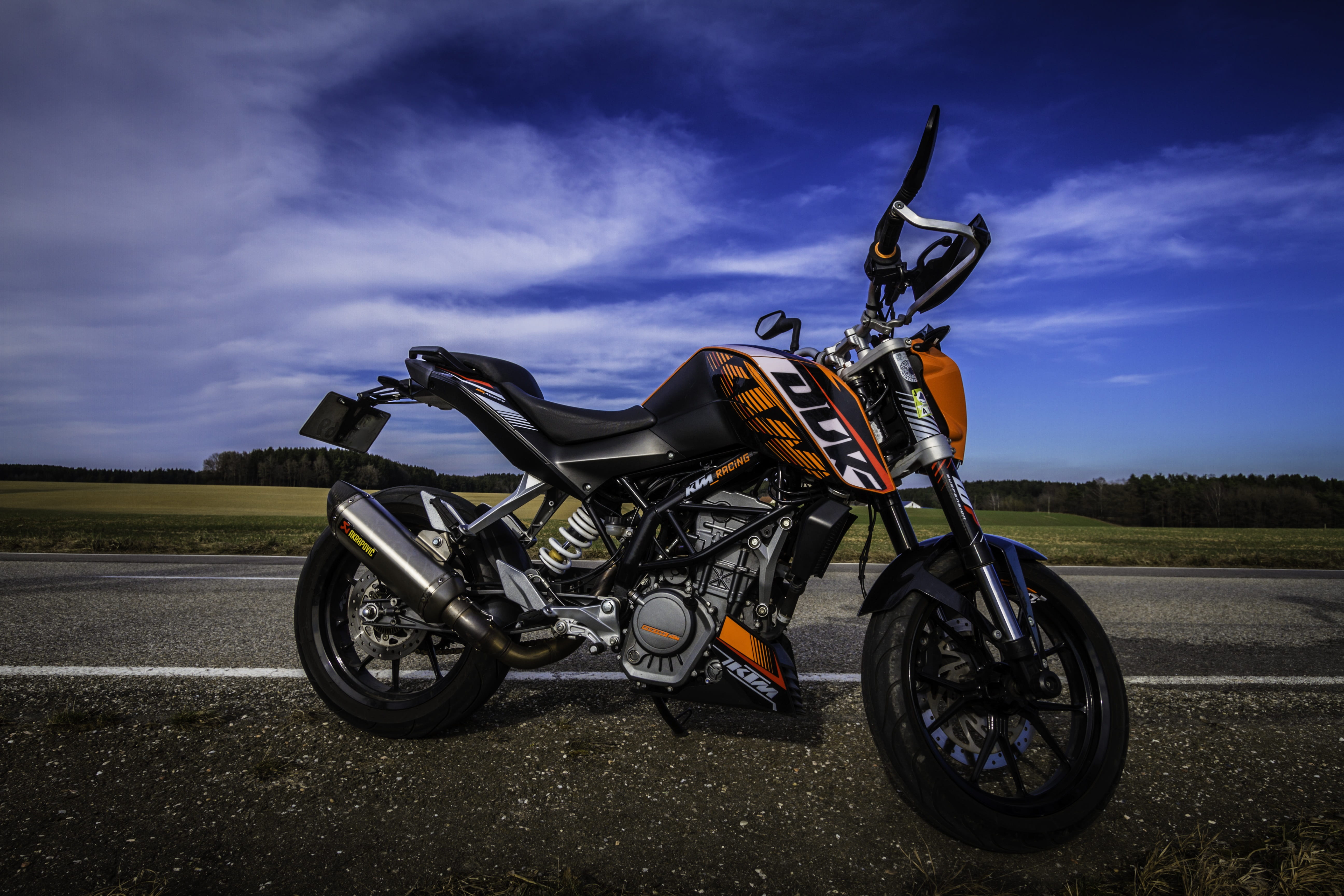 sunlight, duke, no people, cloud - sky, street, view, field, wheel, black, sky, ktm, out, outdoors, parking, day, leisure, 5K, city, land, landscape, nature, HD Wallpaper
