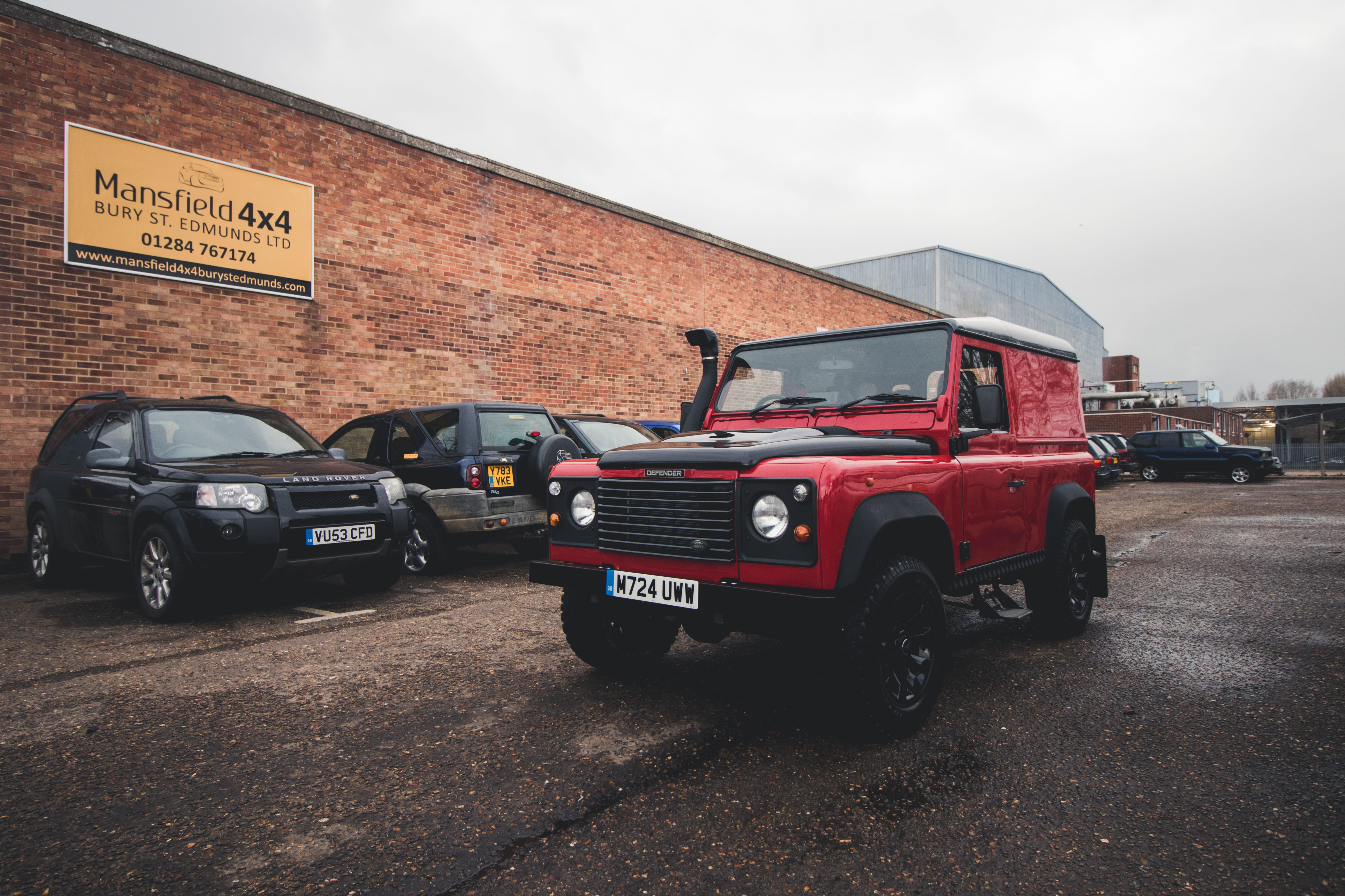sky, land vehicle, outdoors, defender, truck, offroad, vehicle, land, road, rover, red, day, wheel, 5K, text, communication, city, parking lot, land rover defender, HD Wallpaper