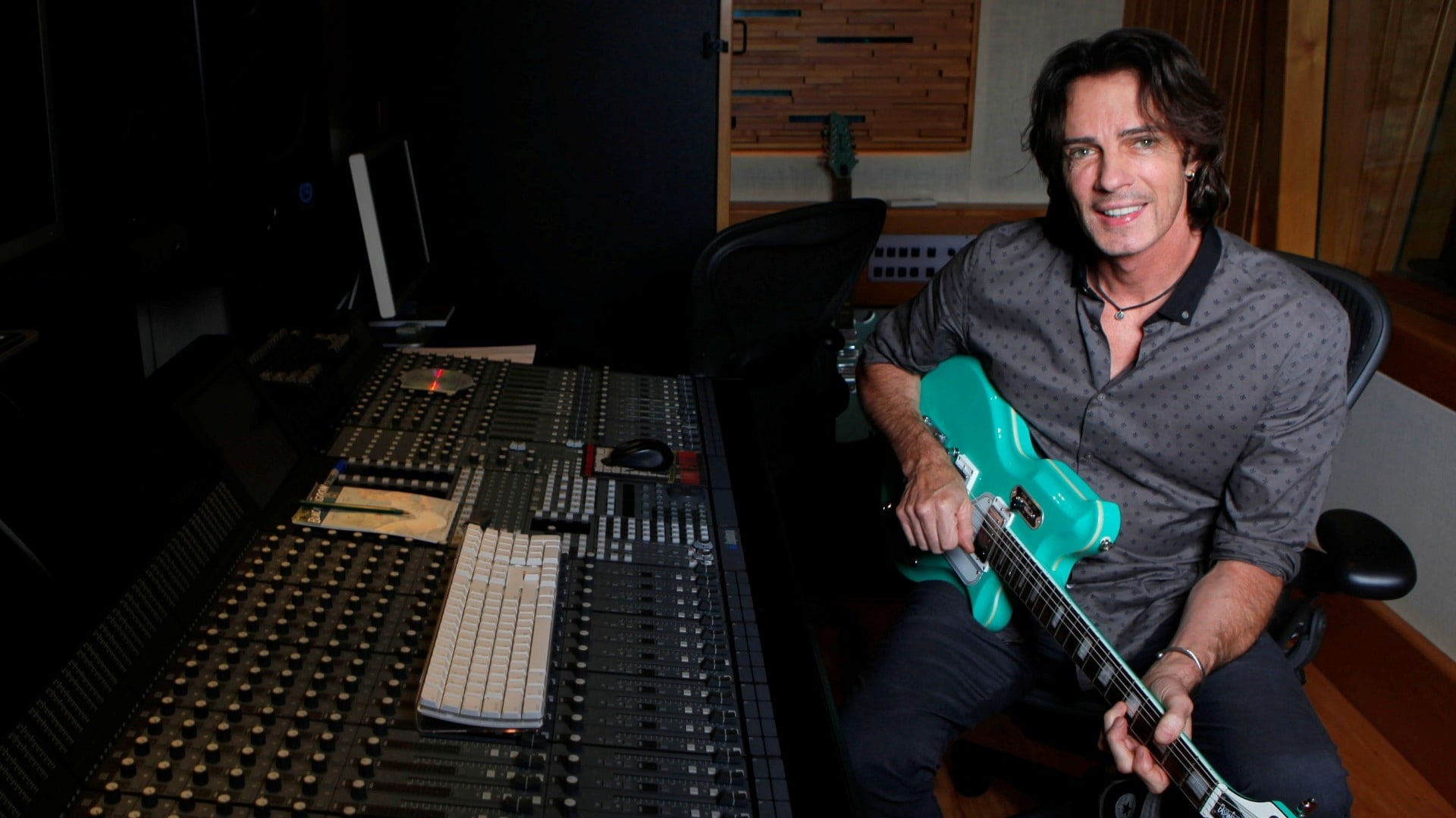 smile, portrait, sound mixer, guitar, musician, holding, recording studio, looking at camera, smiling, electric, audio equipment, 1080P, teal, musical instrument, HD Wallpaper