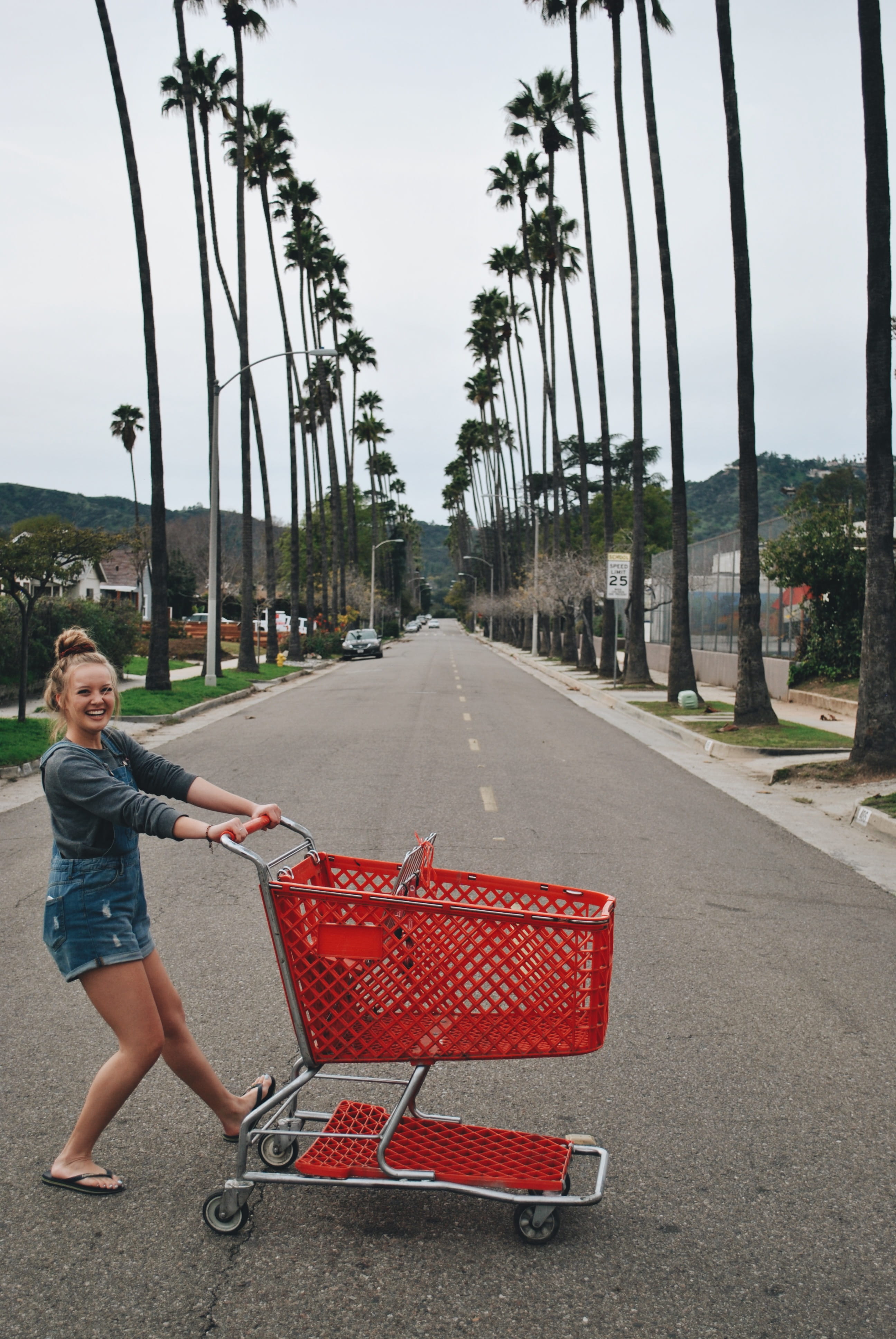 outdoors, child, day, tarmac, tool, lifestyles, one person, shopping cart, shorts, car, 4K, casual clothing, footwear, real people, road, female, shoe, Phone HD Wallpaper