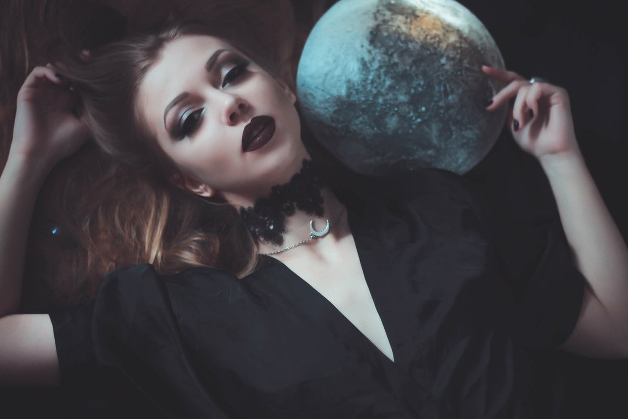 young woman, black clothing, globe, model, rings, lying on back, makeup, necklace, long hair, choker, dark eyes, looking at viewer, lipstick, women indoors, HD Wallpaper