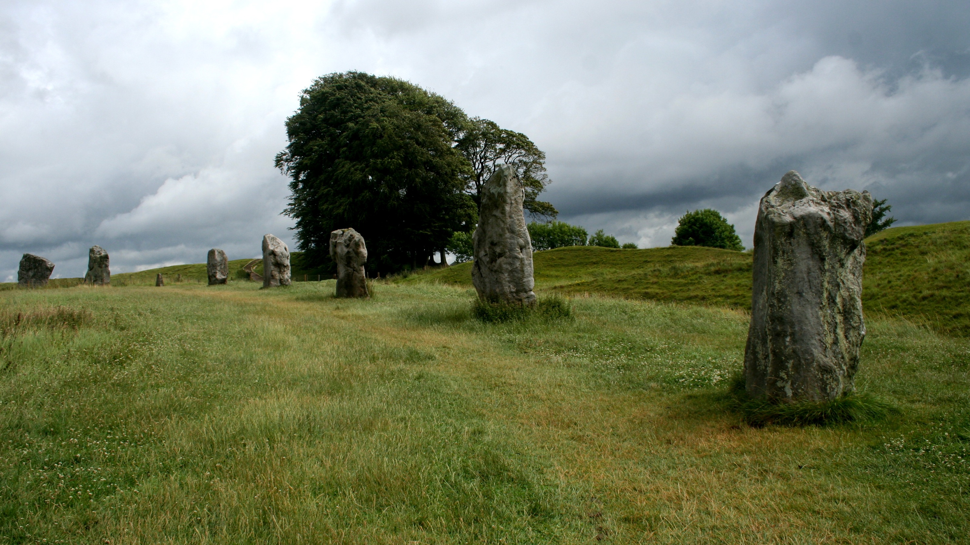 tranquility, no people, land, nature, cloud - sky, near, environment, 2K, rock, england, monument, circle, pathway, ancient, outdoors, stone, field, archaeology, HD Wallpaper