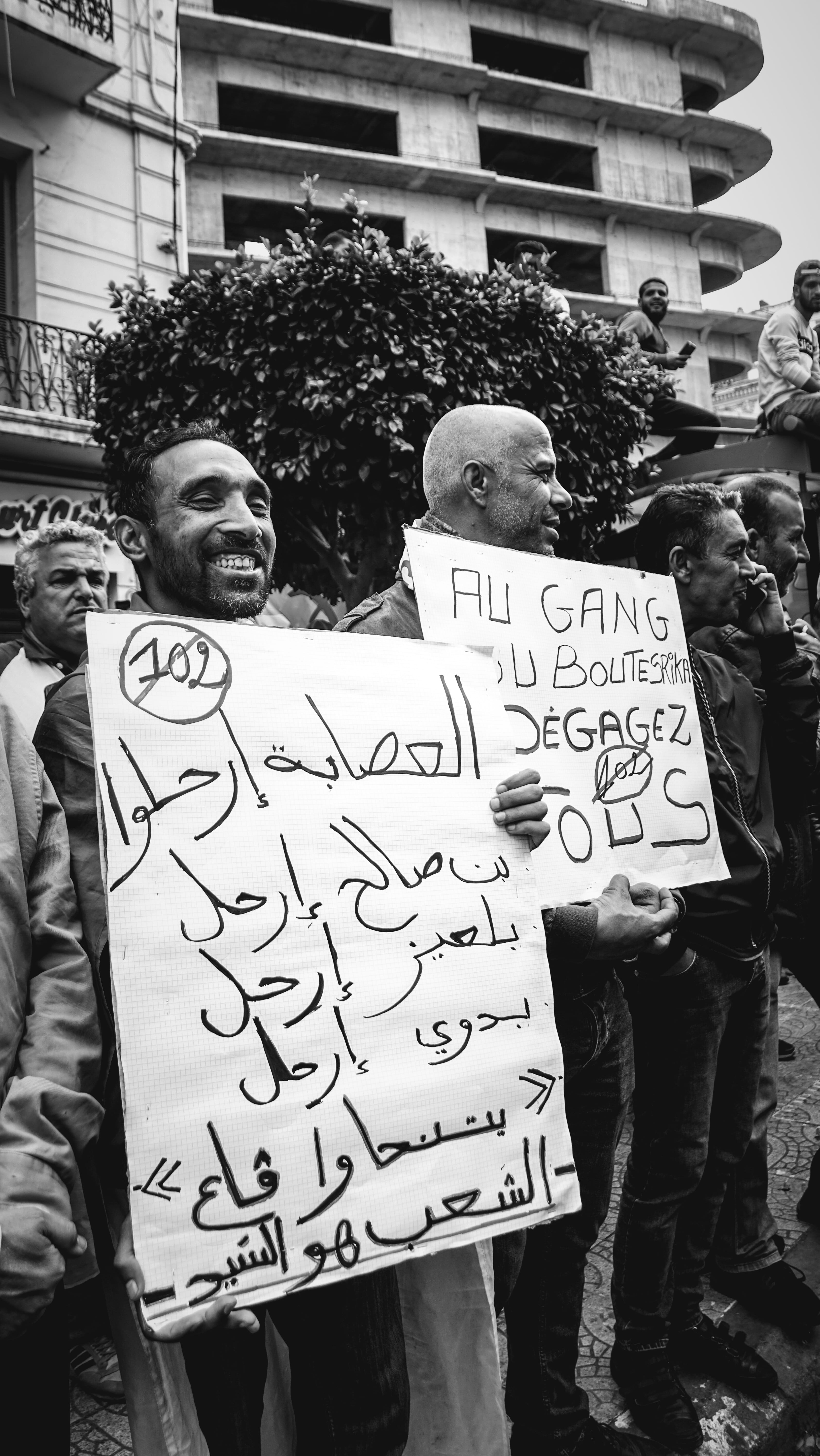 built structure, happy, text, architecture, algeria, message, crowd, human, placard, person, happypeople, positive emotion, real people, banner, grand post, Phone HD Wallpaper