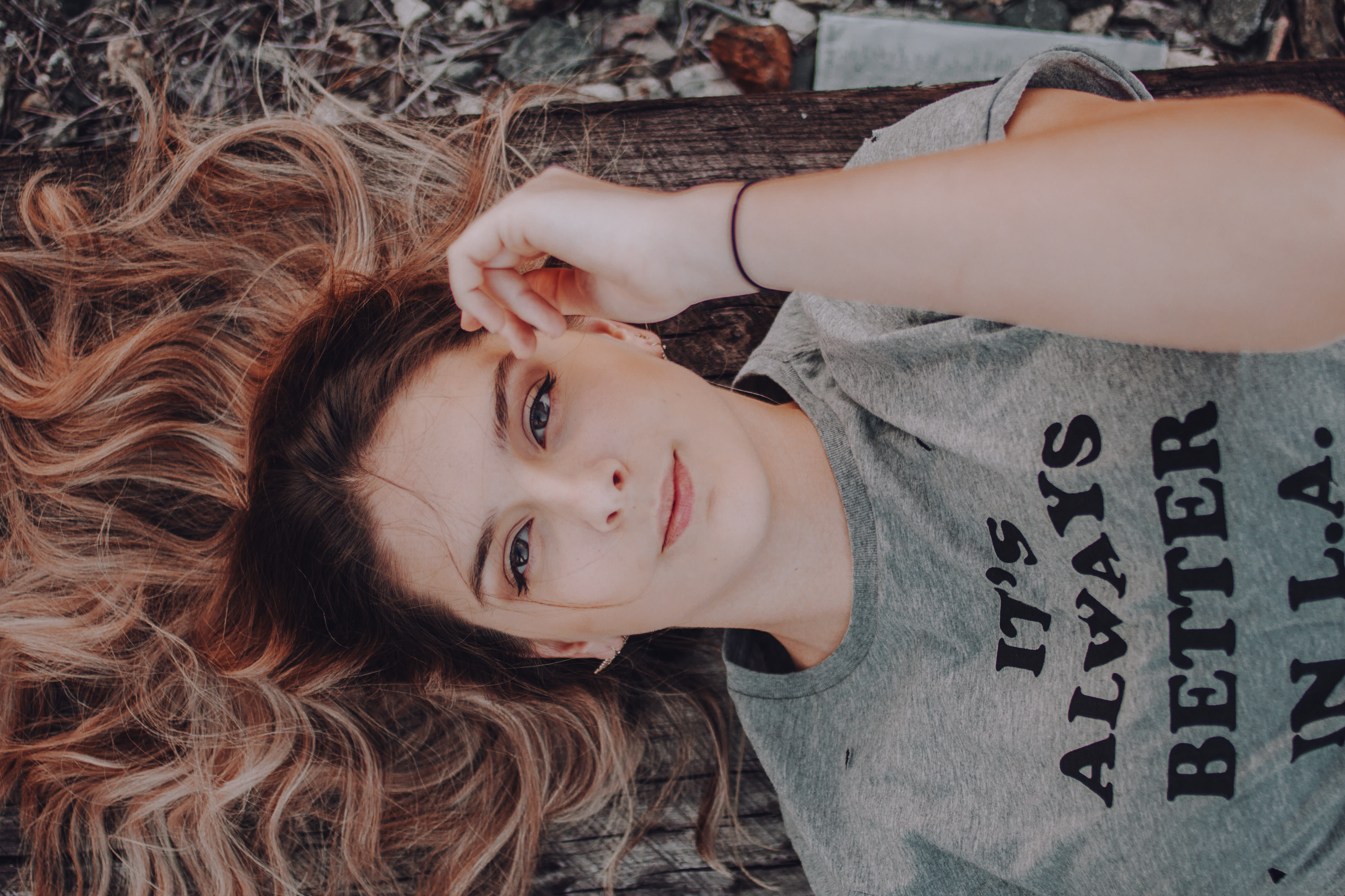 looking at camera, Views, lying on back, females, innocence, 5K, gray, young Women, ground, hair, face, one woman only, one Person, brown, headshot, leisure activity, HD Wallpaper