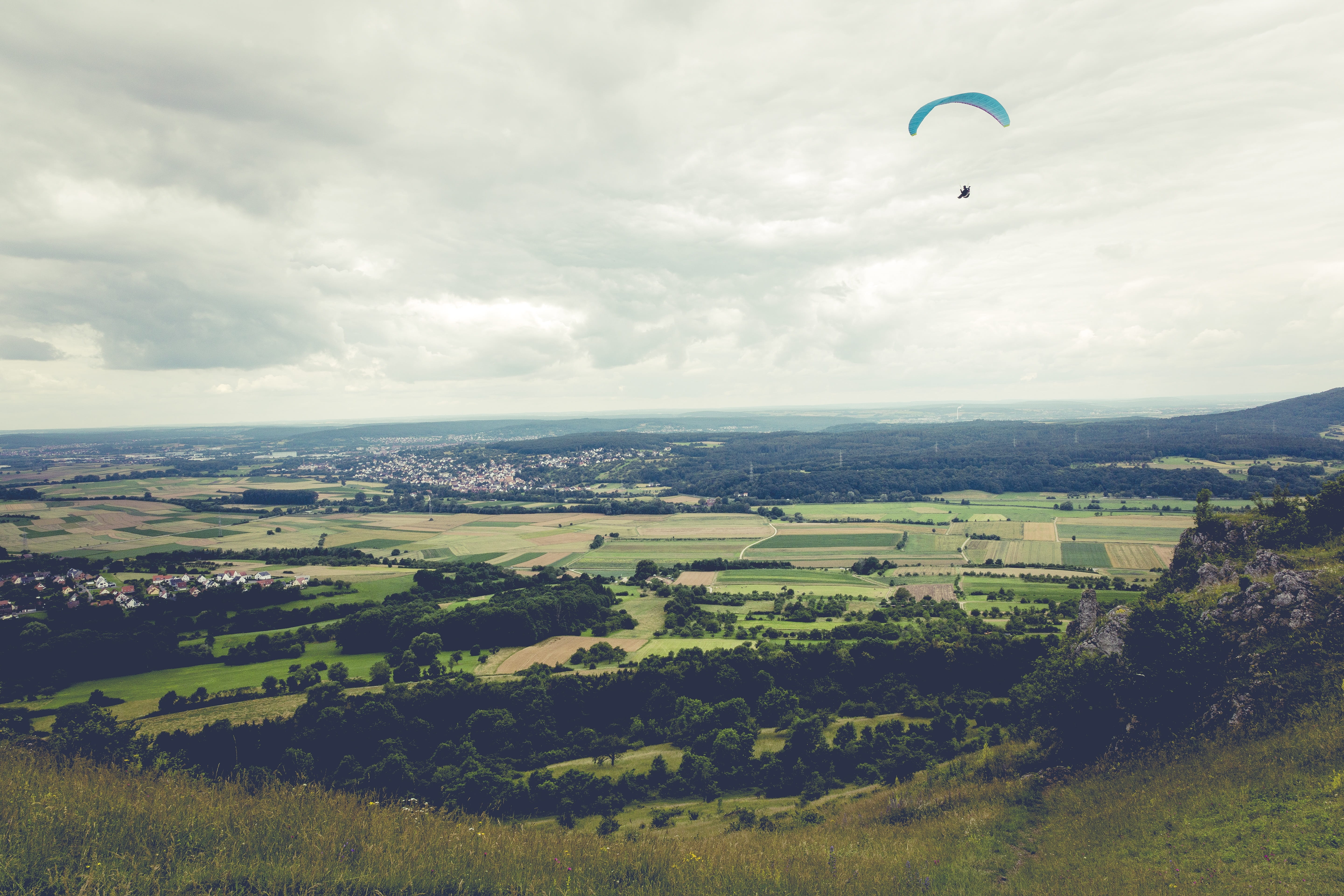adventure, flight, plant, kite, summer, sky, franconian switzerland, dom, beauty in nature, land, cloud - sky, field, rural scene, freedom, person, extreme sports, HD Wallpaper