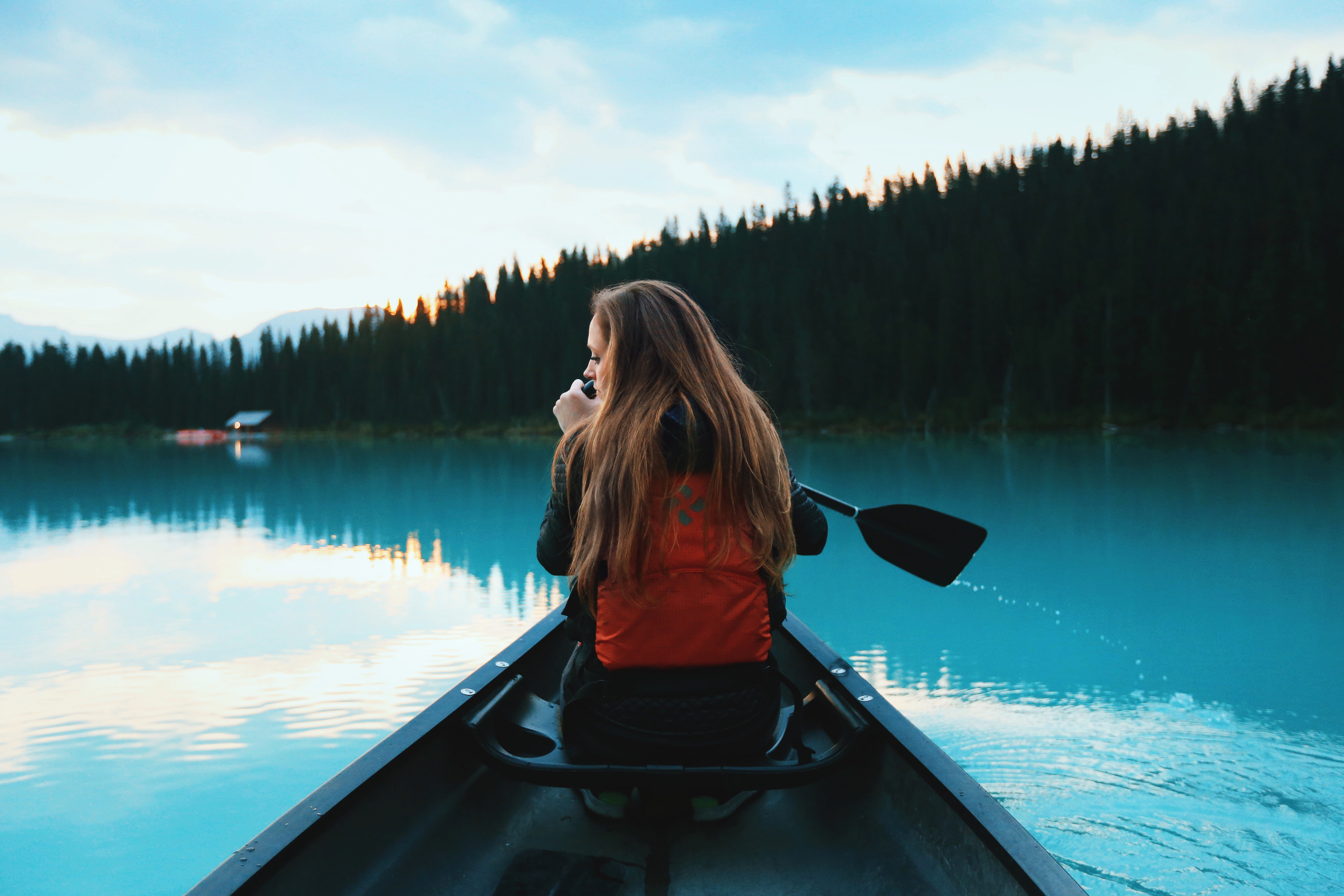 hairstyle, beauty in nature, girl, sitting, tranquility, leisure, nature, sky, adult, women, water, lifestyles, one person, paddling, tree, canoe, real people, HD Wallpaper
