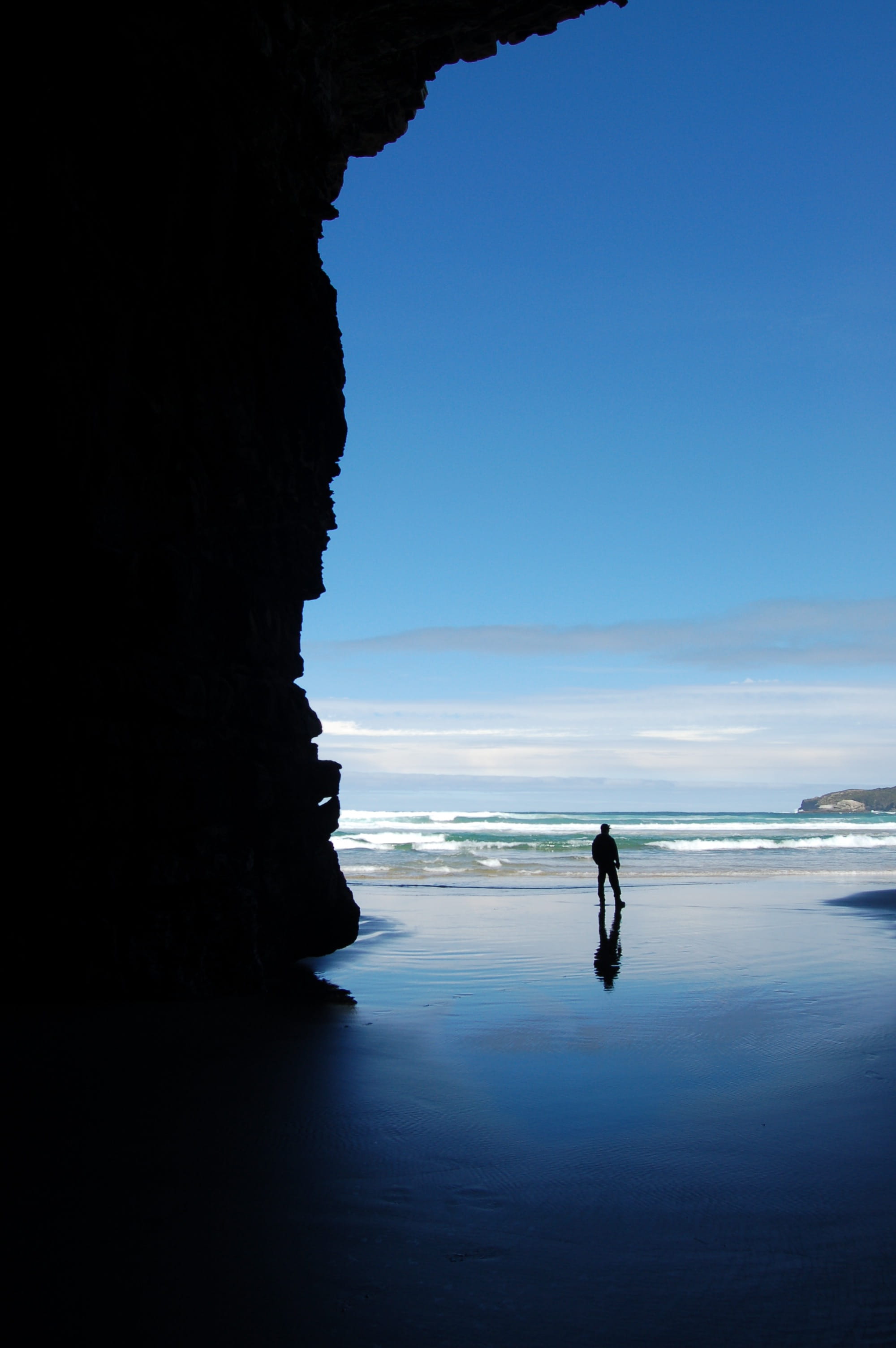 cathedral cove, contemplation, ocean, landscape, cave, tranquility, 2K, beauty in nature, person, rock formation, solid, nature, explore, sea, silhouette, Phone HD Wallpaper