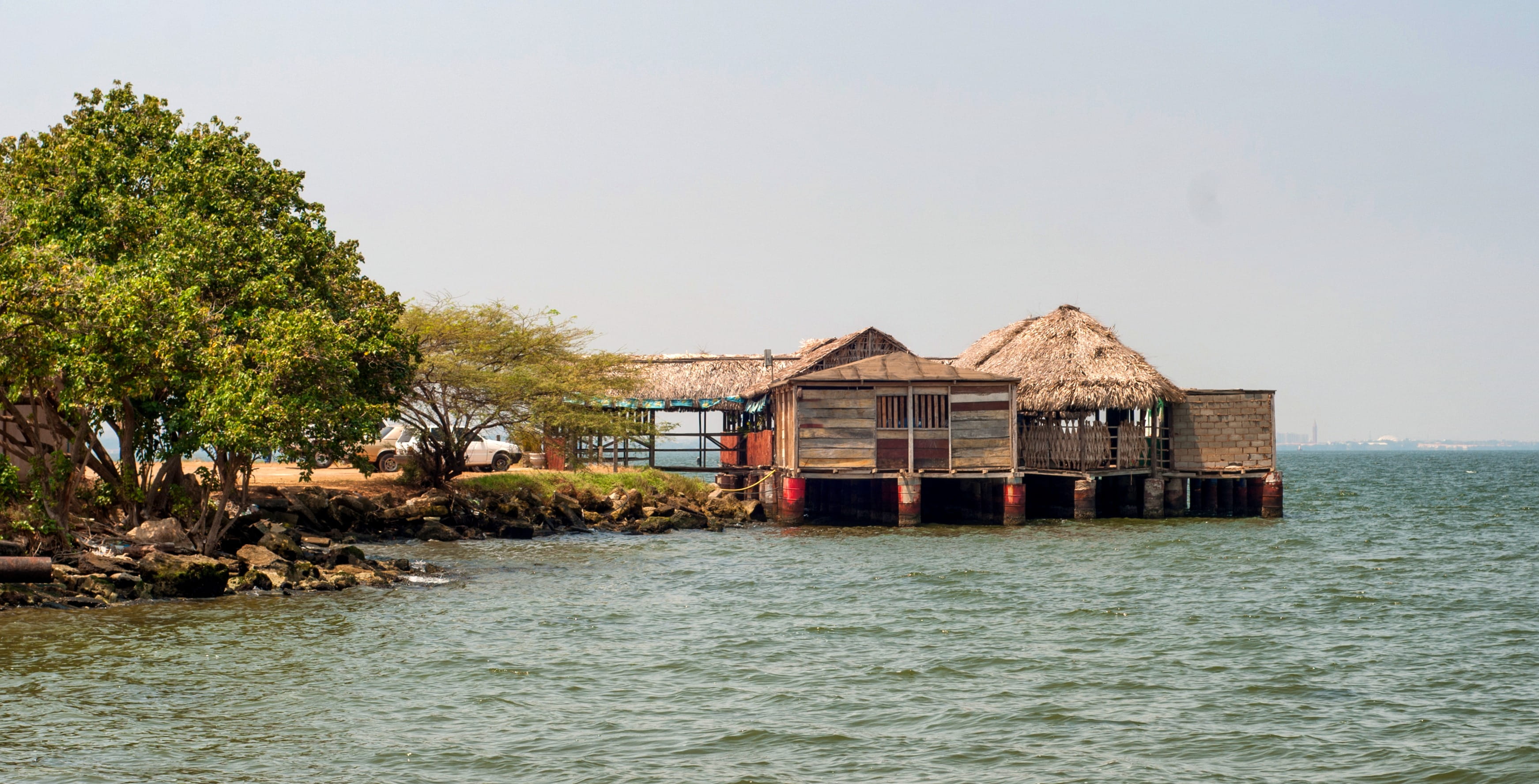 tree, built structure, stilt, sky, 2K, residential district, day, Venezuela, building, plant, tranquility, hut, venezuela, Lake Maracaibo, water, clouds, HD Wallpaper