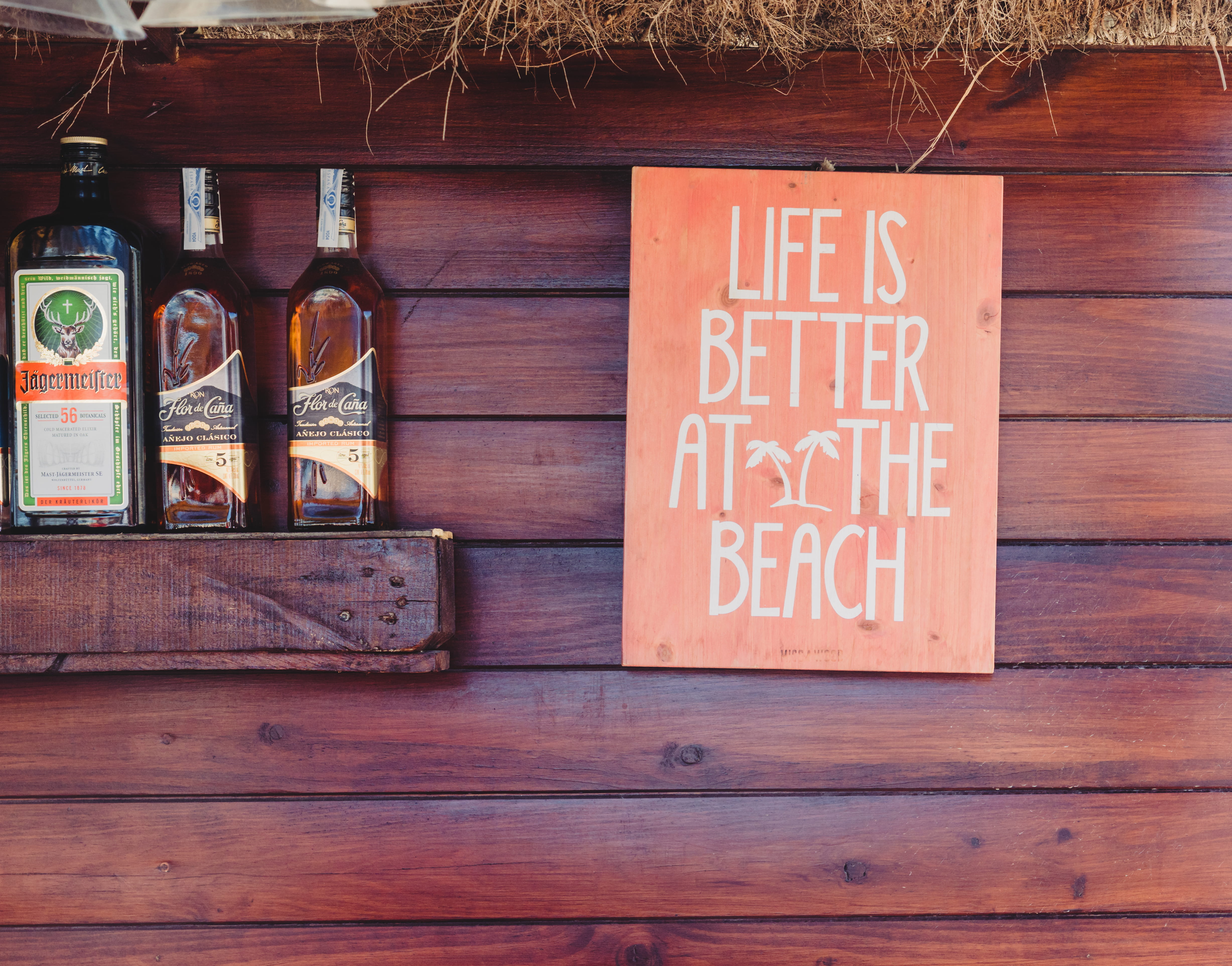 beach, life, bottles, no people, liquor, outdoors, bottle, near, brand, western script, assorted, built structure, 4K, wood, window, wall, hanging, whiskey, HD Wallpaper