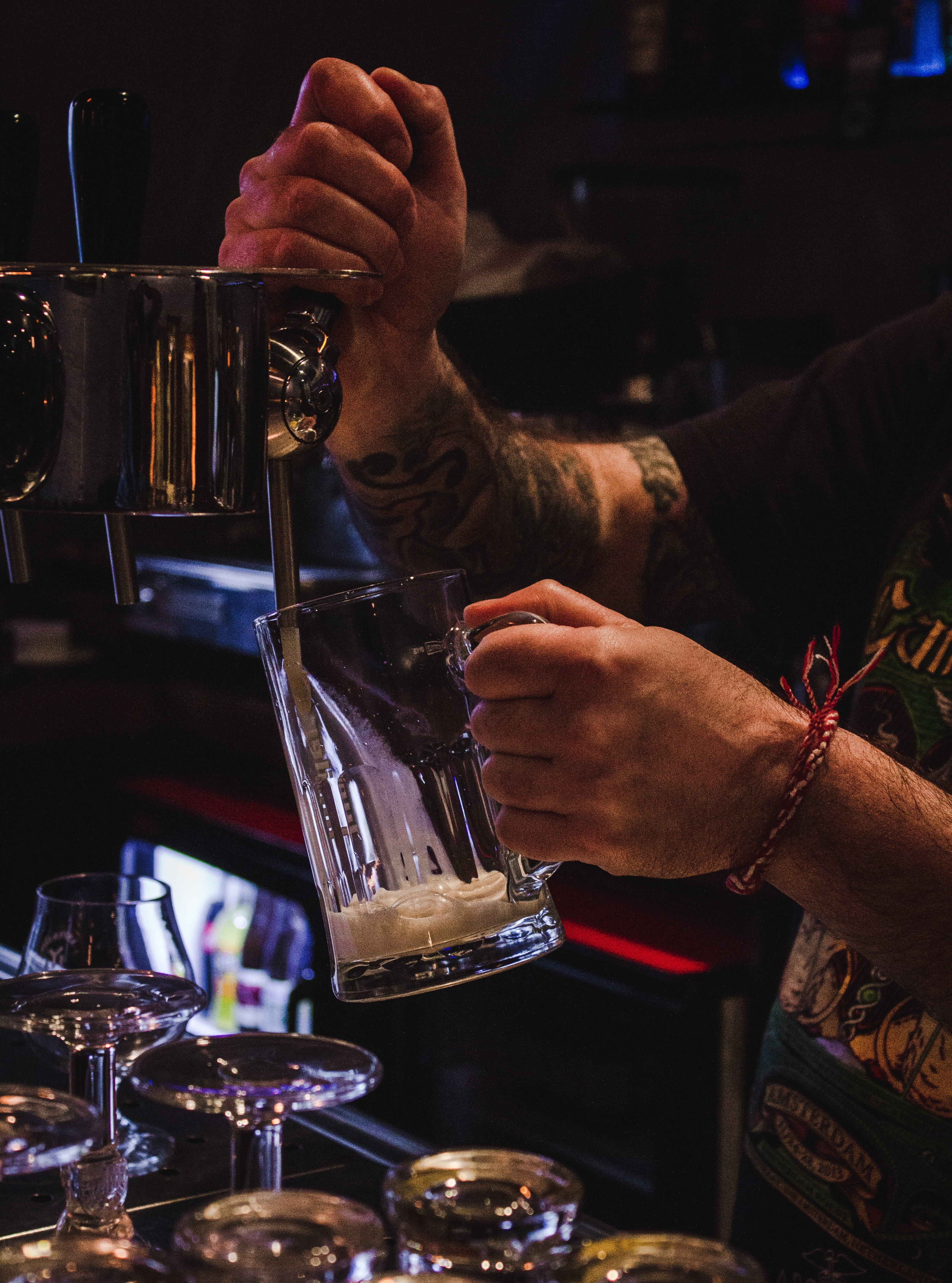 drinking glass, real people, occupation, nightlife, holding, alcohol, restaurant, bartender, pouring, beer, handle, human body part, refreshment, person, Phone HD Wallpaper