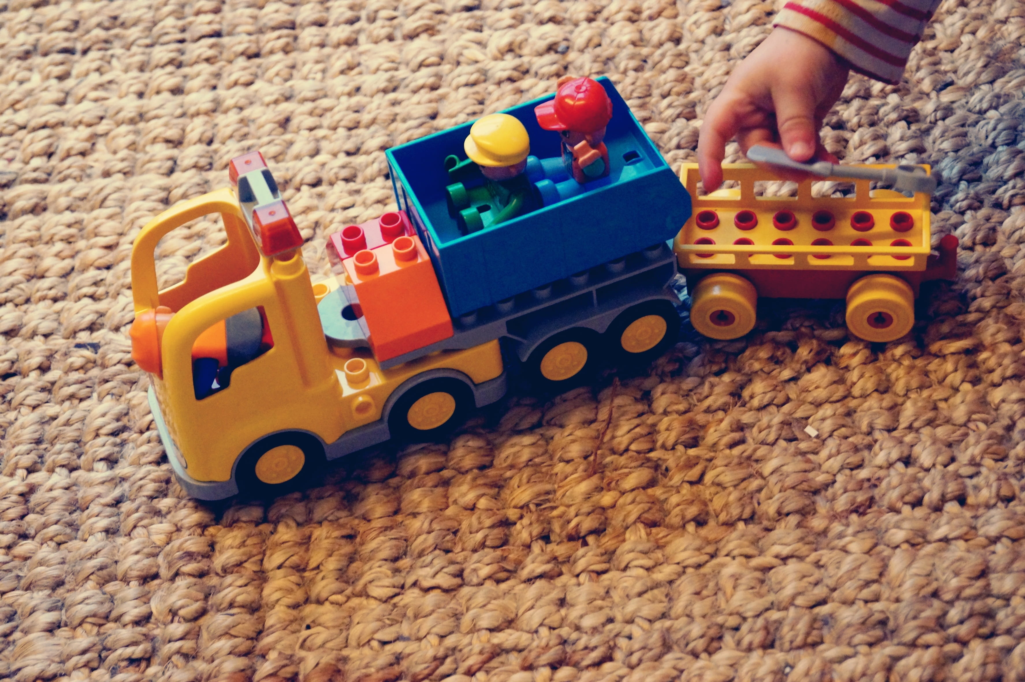 childhood, toy car, one person, construction vehicle, playing, building blocks, males, offspring, real people, car, carpet, toy block, toy, leisure activity, HD Wallpaper
