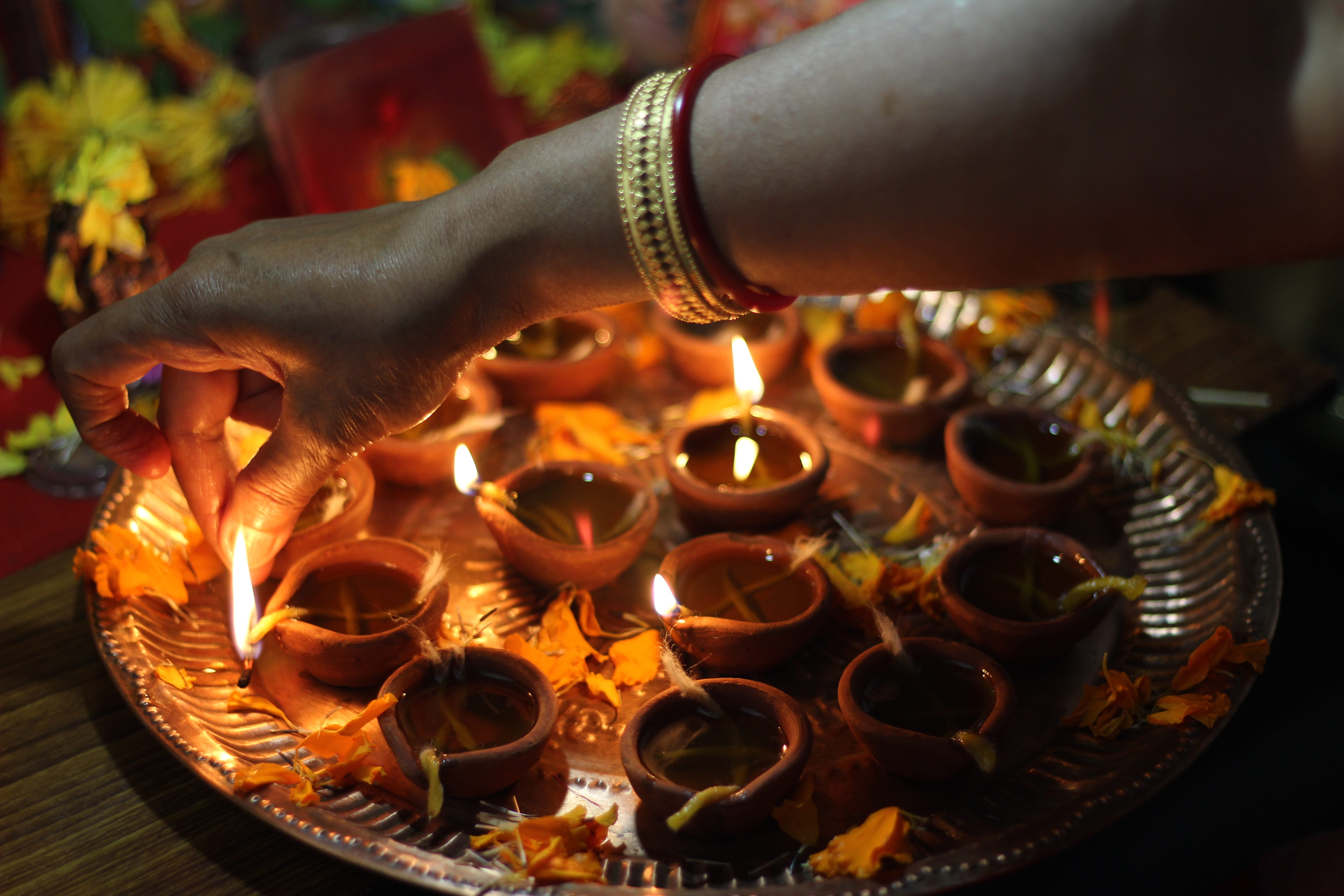 human body part, close-up, diya, electric lamp, occasion, flame, human hand, arm, 5K, celebration, fire, women, finger, holding, bracelet, traditions, HD Wallpaper