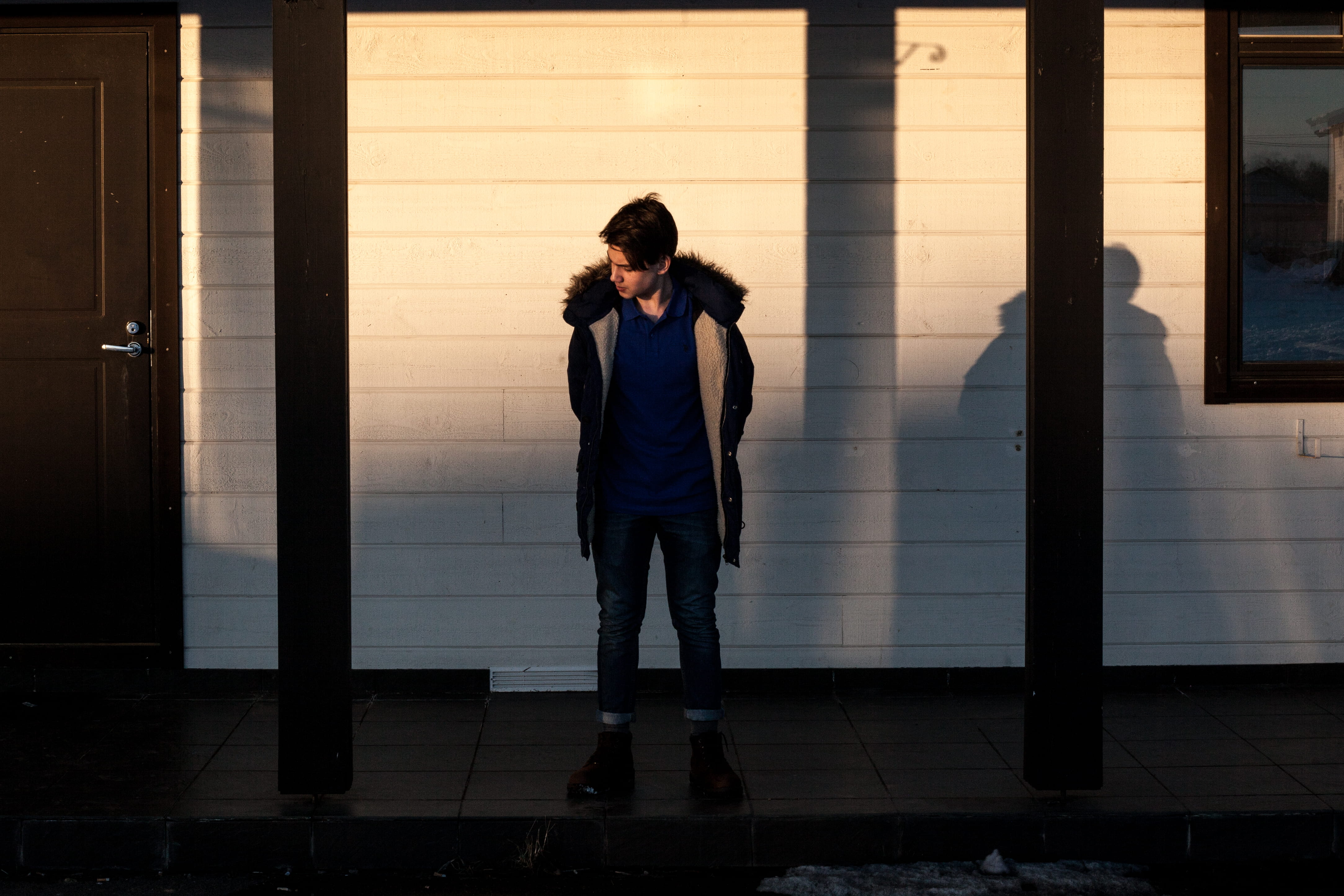 jacket, tiled floor, sunlight, looking away, one person, modern art, posts, porch, man, shadow, waiting, person, black, flooring, portrait, built structure, HD Wallpaper