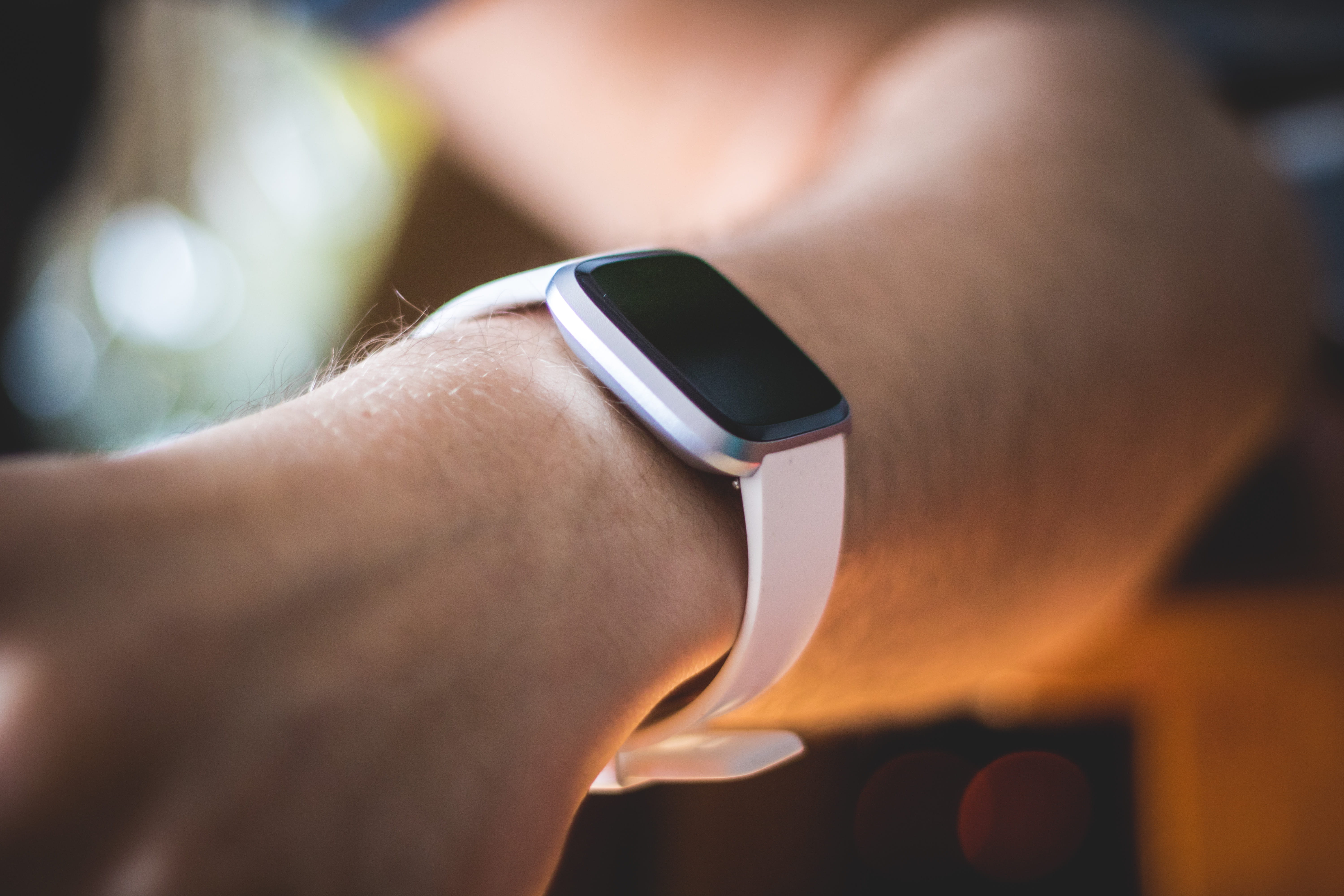 adult, smartwatch, lifestyles, fitbit, versa, fitbit versa, wristwatch, sunglasses, human limb, human hand, accessories, sun, accessory, checking the time, HD Wallpaper