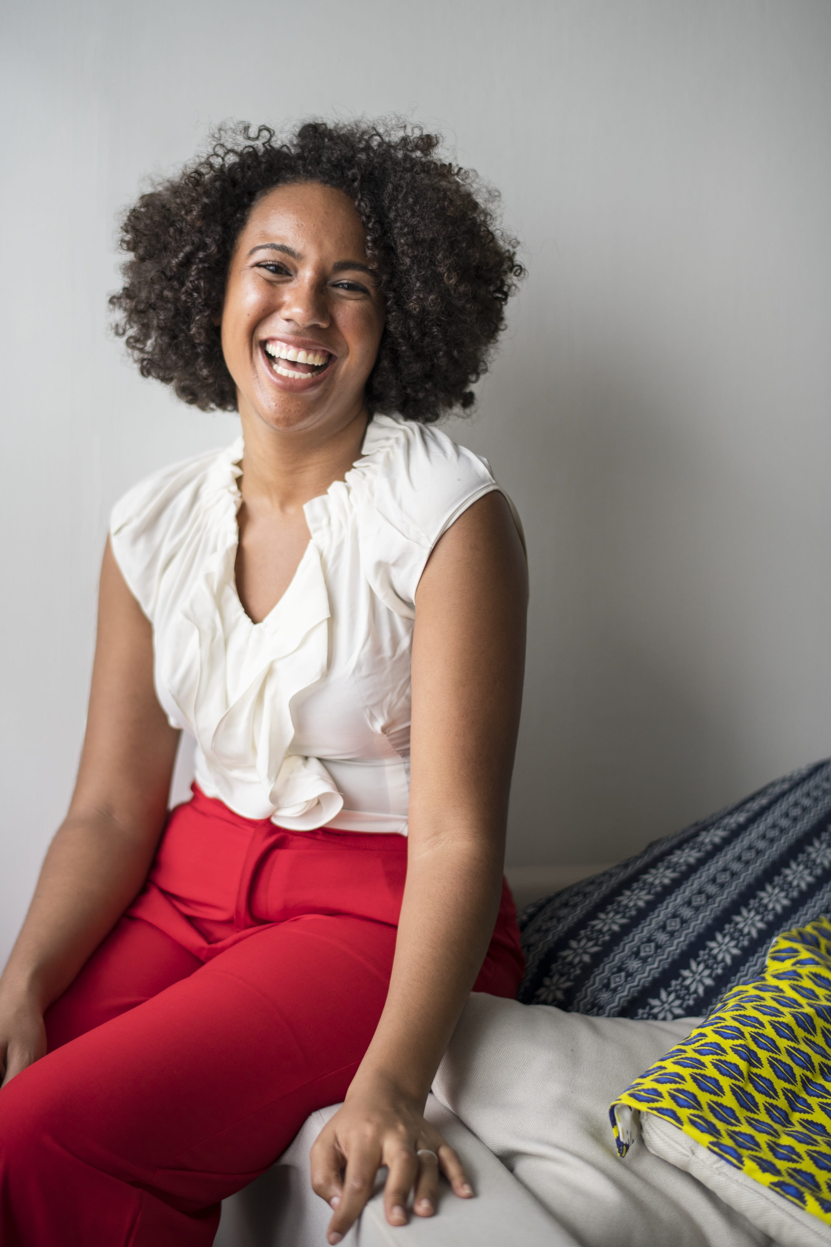 portrait, couch, women, chilling, black, teeth, curvy, afro, three quarter length, sitting, indoors, gorgeous, cushions, young adult, one person, 4K, enjoyment, Phone HD Wallpaper