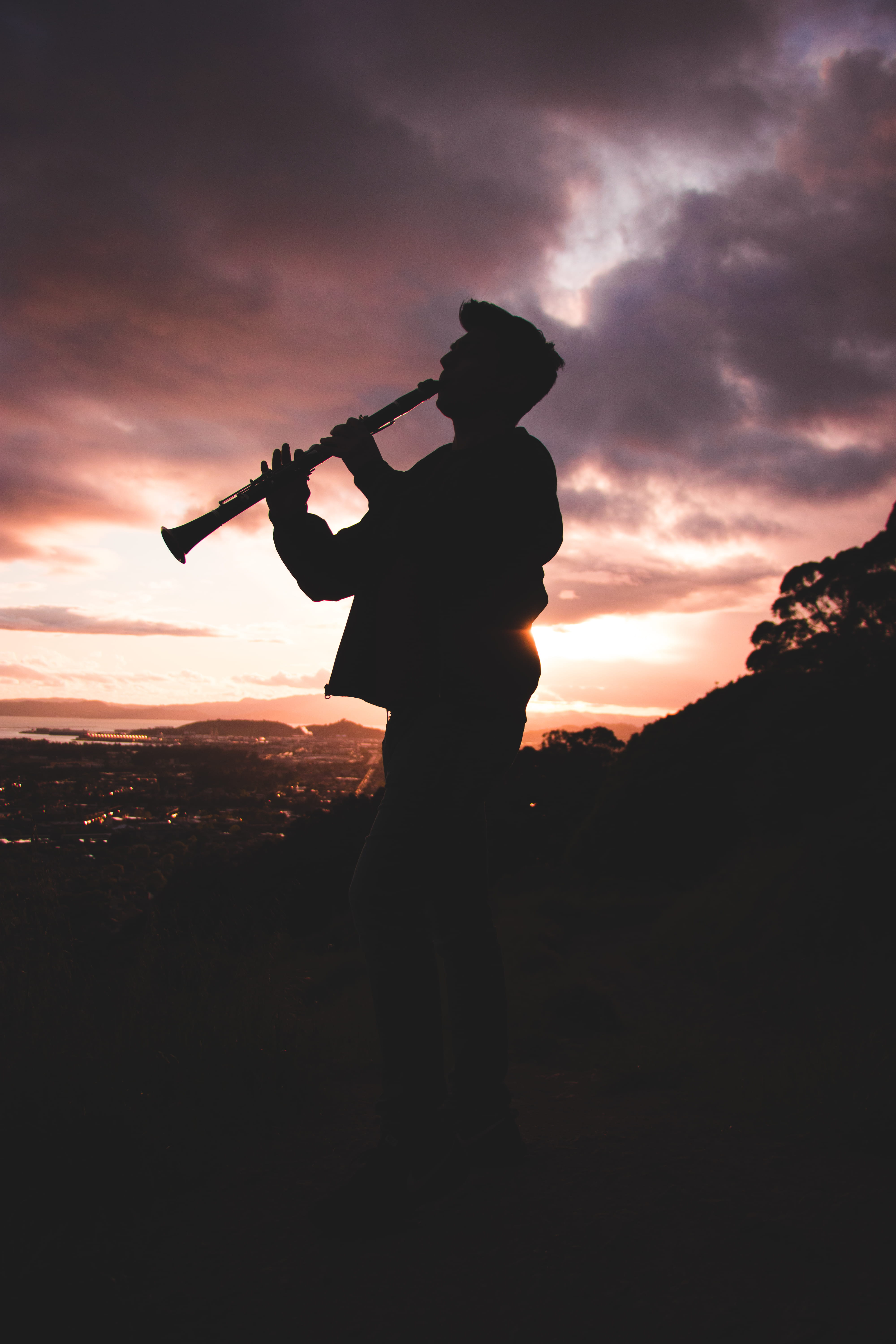 person, 5K, trumpet, string instrument, silhouette, playing, dusk, acoustic guitar, real people, clarinet, cloud - sky, music, musician, artist, dawn, Phone HD Wallpaper