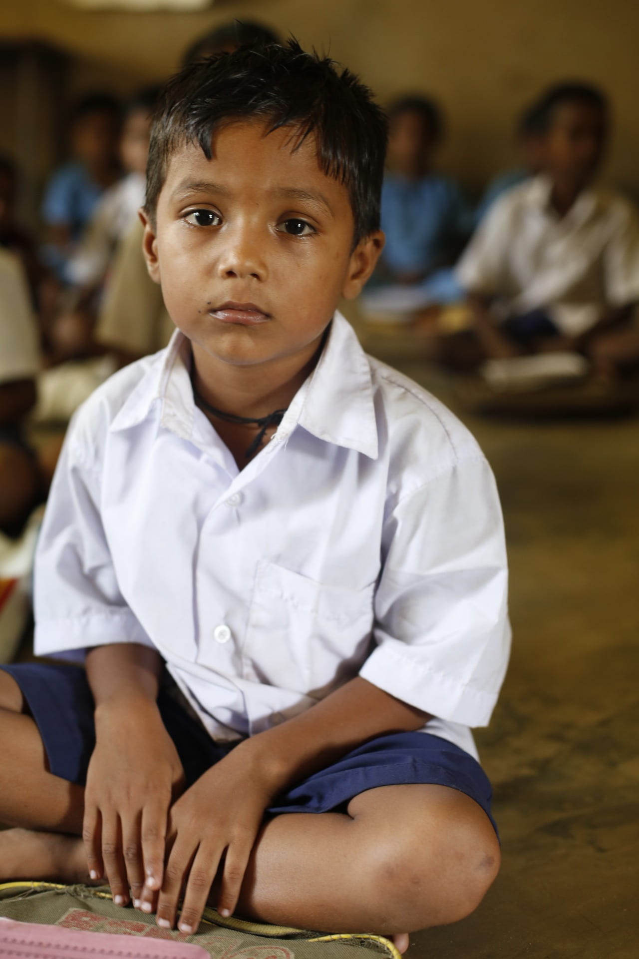 childhood, looking at camera, one person, males, india, innocence, focus on foreground, incidental people, ground, sitting, portrait, boy, sad, casual clothing, Phone HD Wallpaper