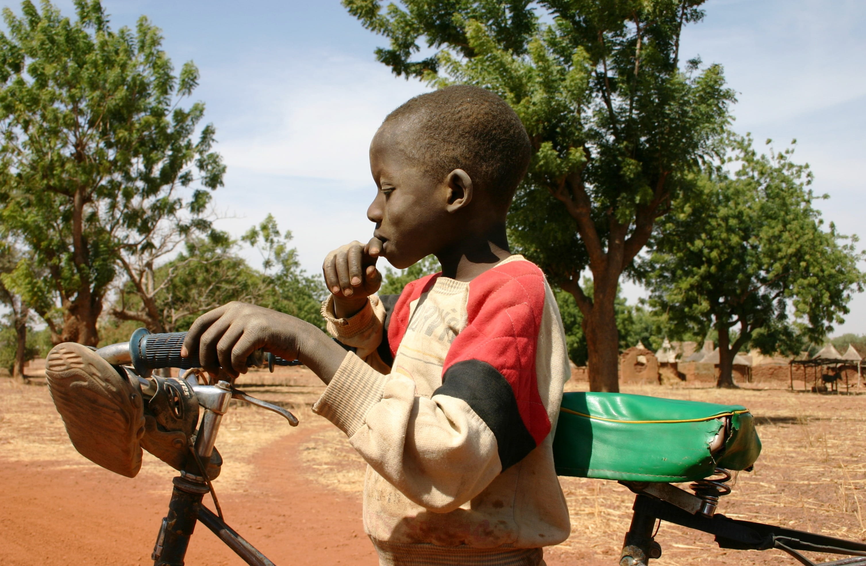 females, lifestyles, day, leisure activity, sunlight, africa, real people, child, men, land, casual clothing, side view, sitting, males, bicycle, plant, HD Wallpaper