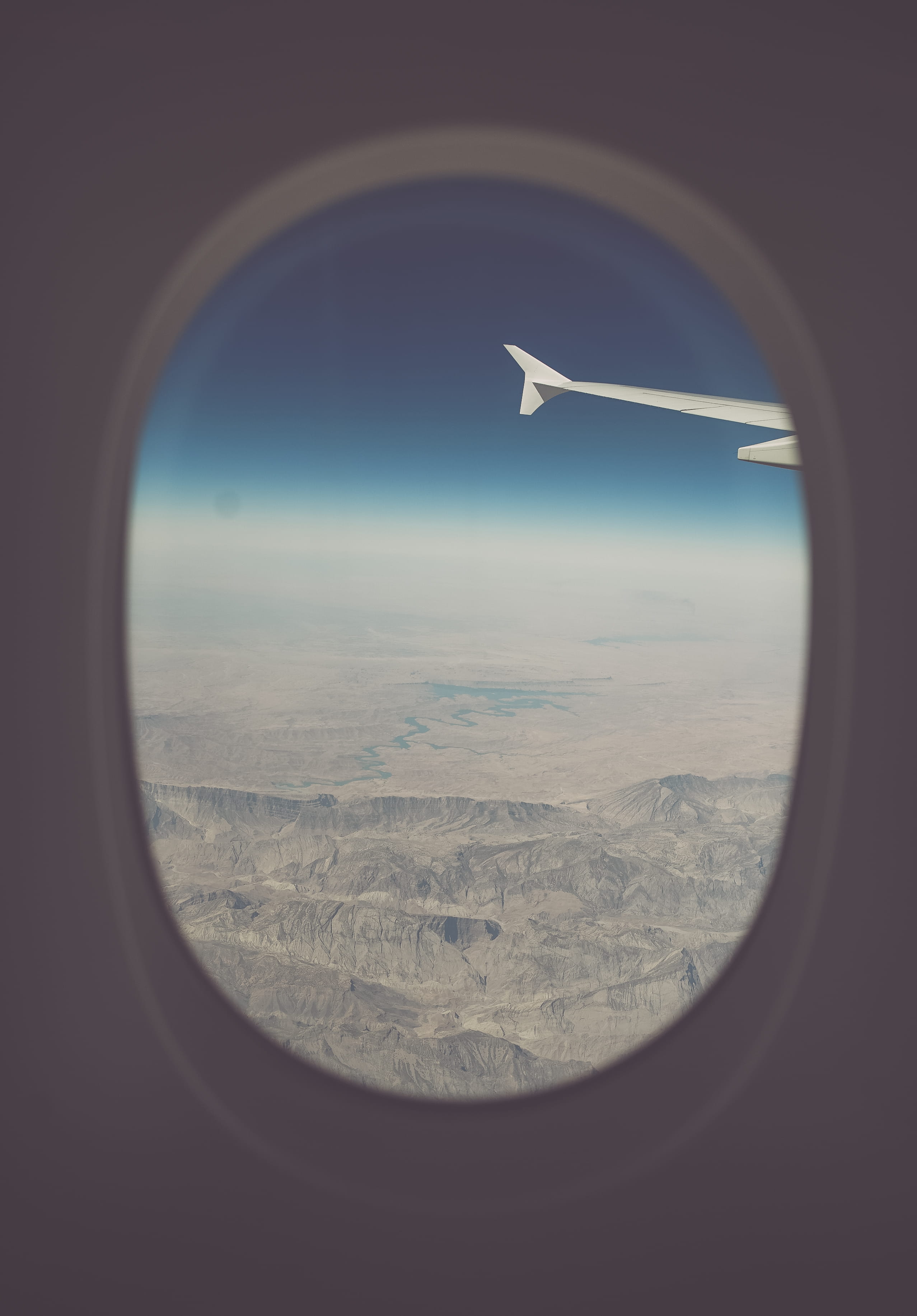 2K, journey, blue, vehicle interior, travel, looking Through Window, motion, outdoors, nature, window, plane, no people, air Vehicle, transparent, Dry Land, Phone HD Wallpaper
