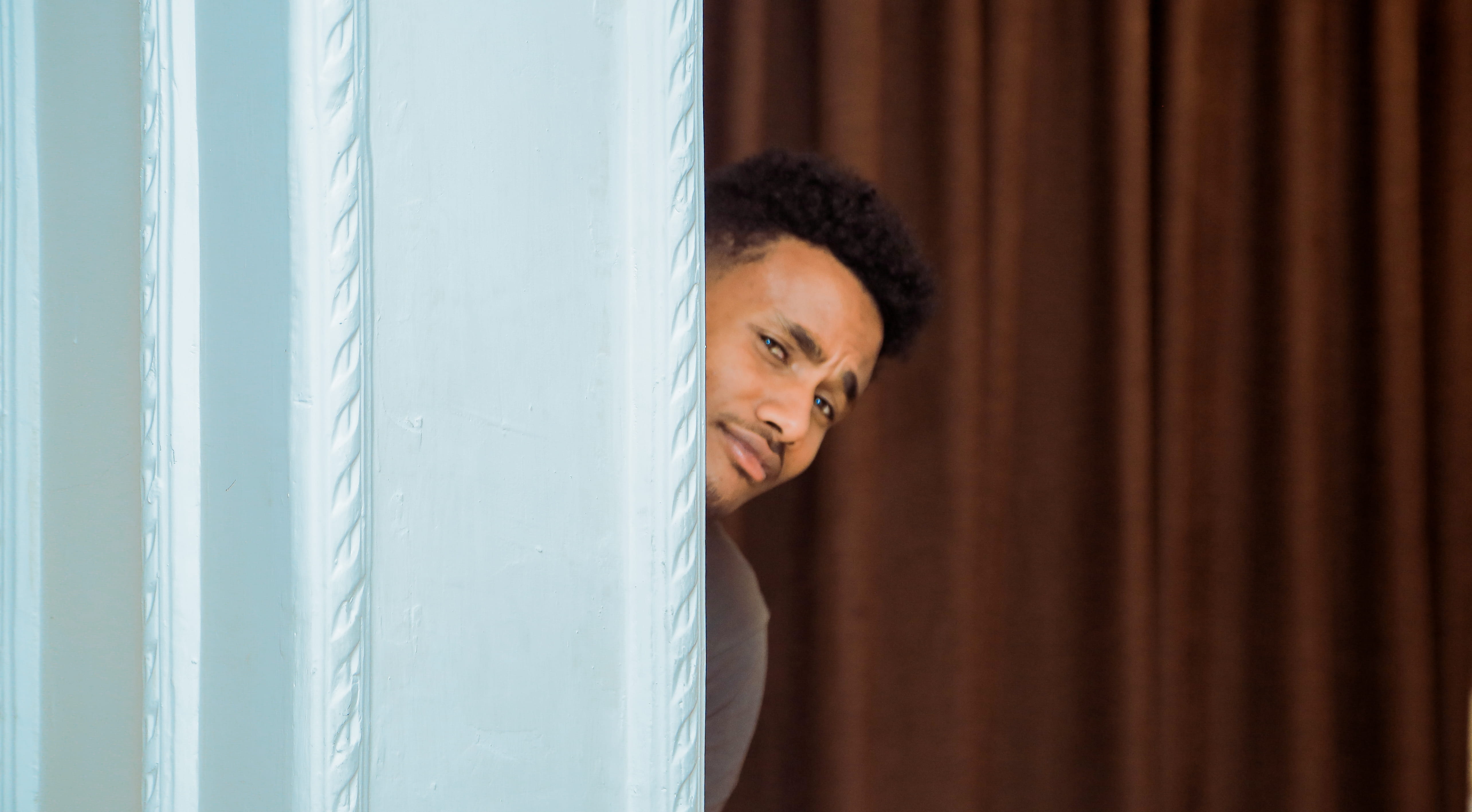 curtain, man, unsure, question, person, window, adult, happiness, luxury, hide, peak, head, peer, copy space, standing, wall, amused, men, mid adult, contemplation, HD Wallpaper