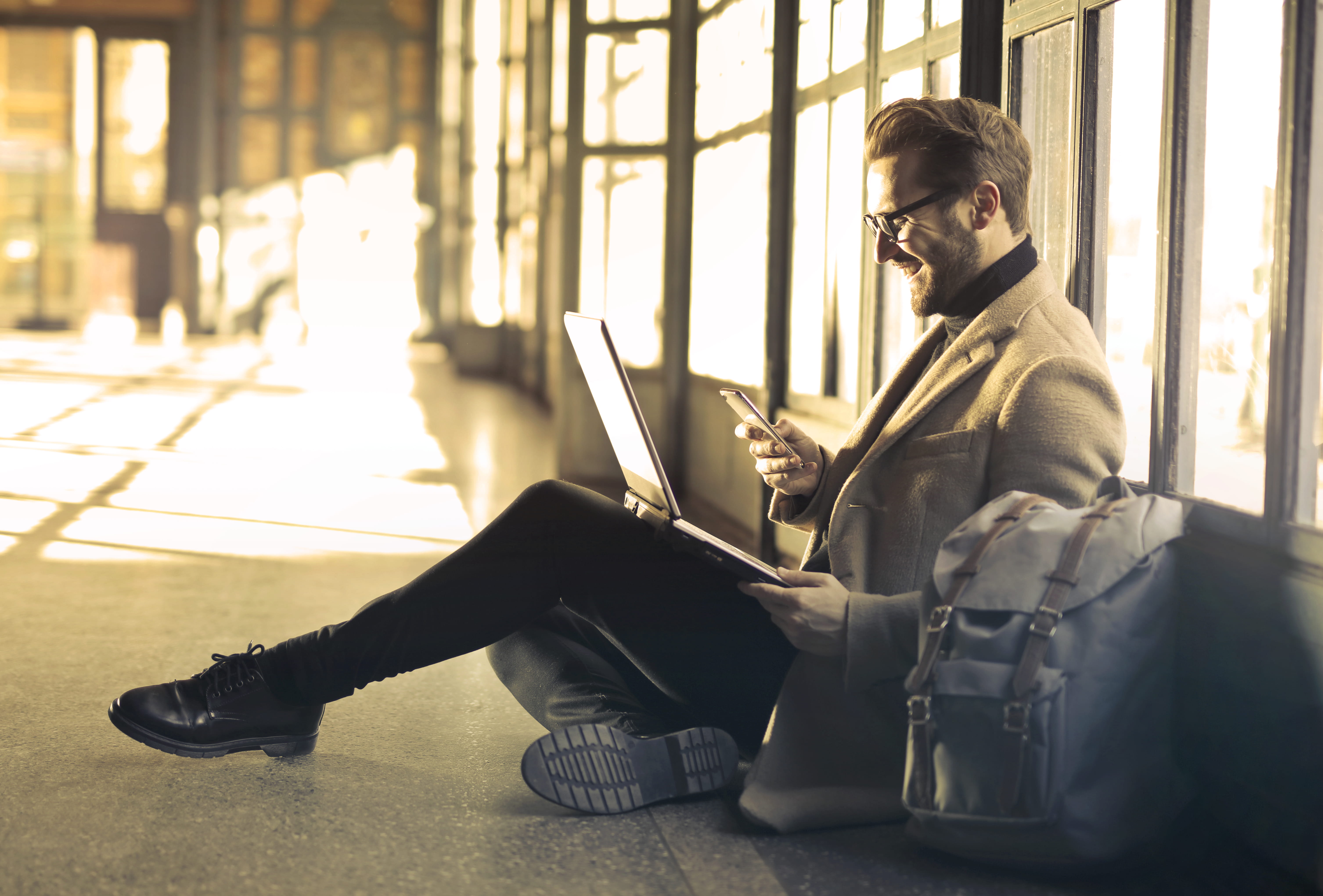 5K, hands, phone, man, smiling, sitting, wear, windows, communication, photography, internet, laughing, young men, full length, screen, real people, computer network, HD Wallpaper