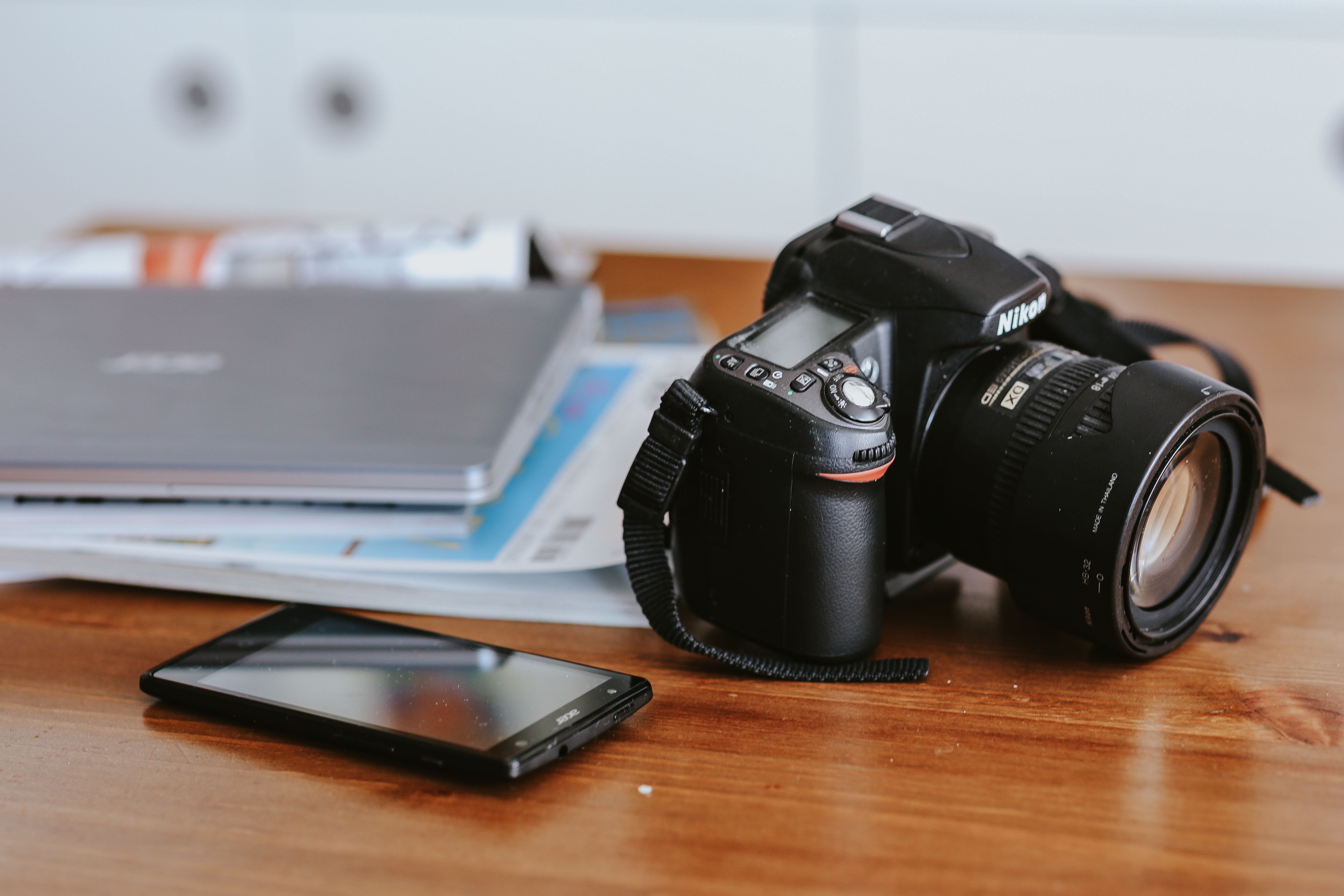 cups of coffee, focus on foreground, office, smartphone, camera - Photographic Equipment, desk, photographic equipment, camera, indoors, technology, furniture, HD Wallpaper