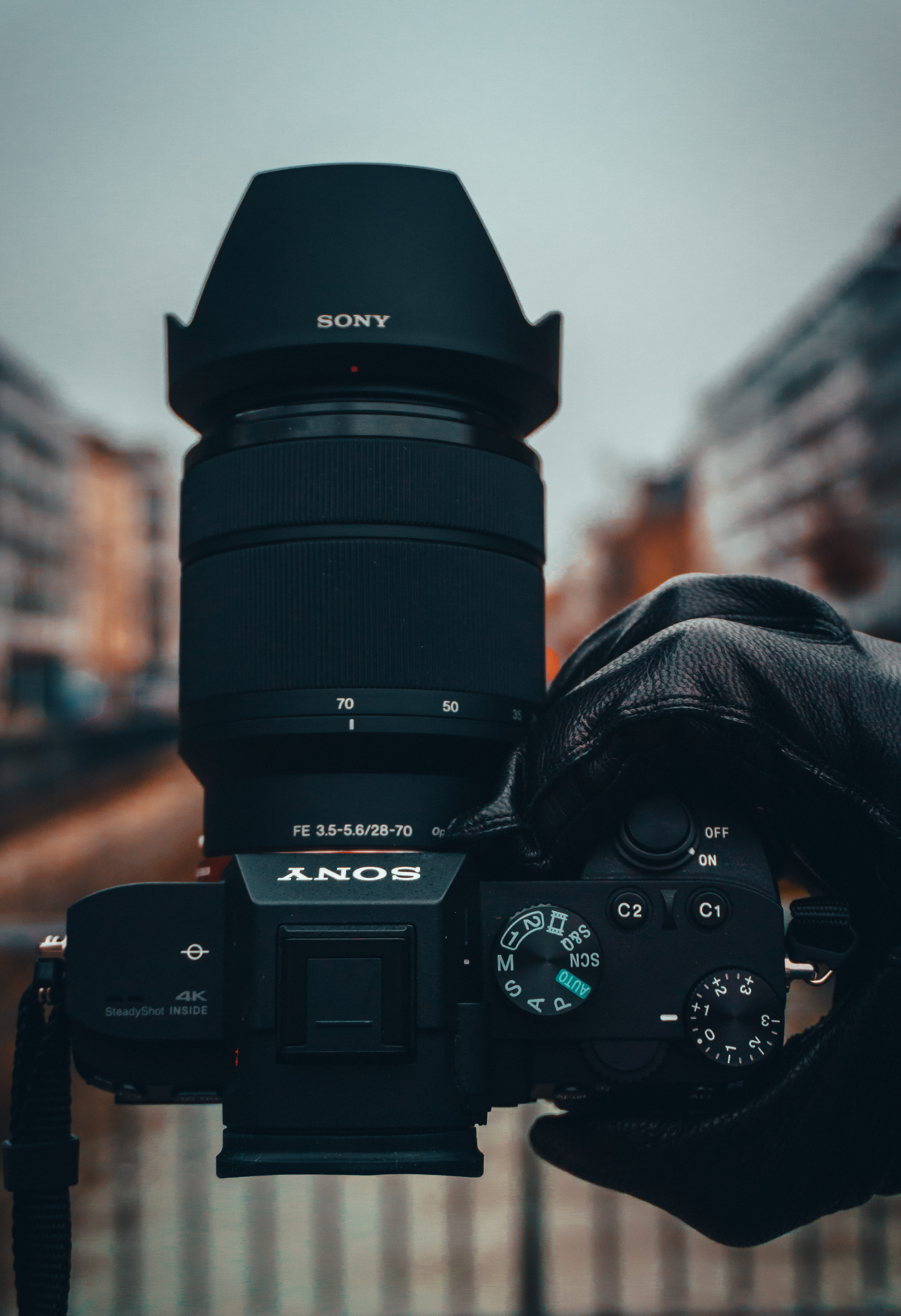 close-up, black color, spoke, day, focus on foreground, city, screen, monitor, portrait, technology, digital camera, keyboard, black, skin, sky, camera - photographic equipment, Phone HD Wallpaper