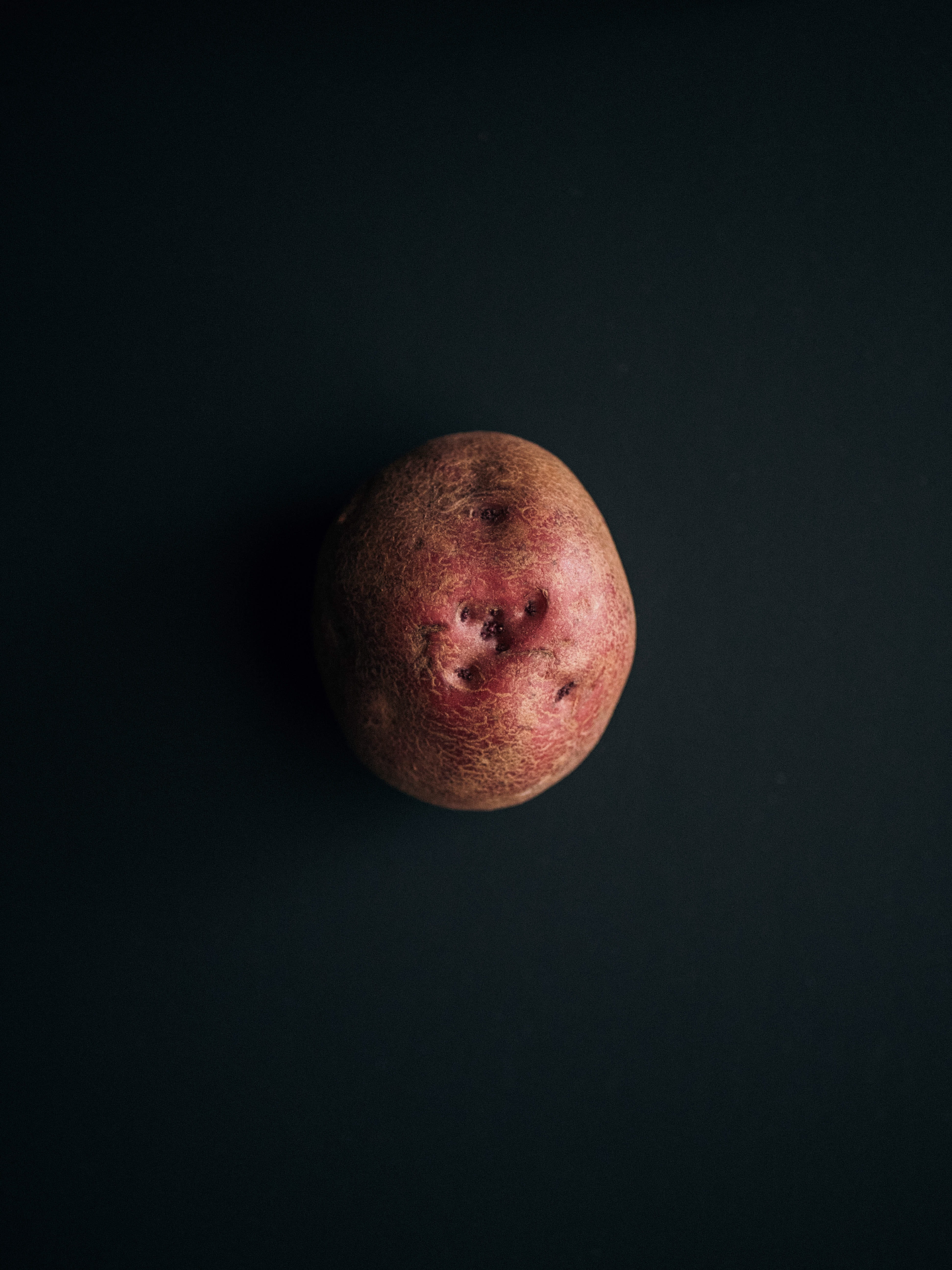 minimal, close-up, indoors, raw potato, dark, still life, simple, black background, light, portrait, south laurel, sweet potato, healthy eating, food and drink, Phone HD Wallpaper