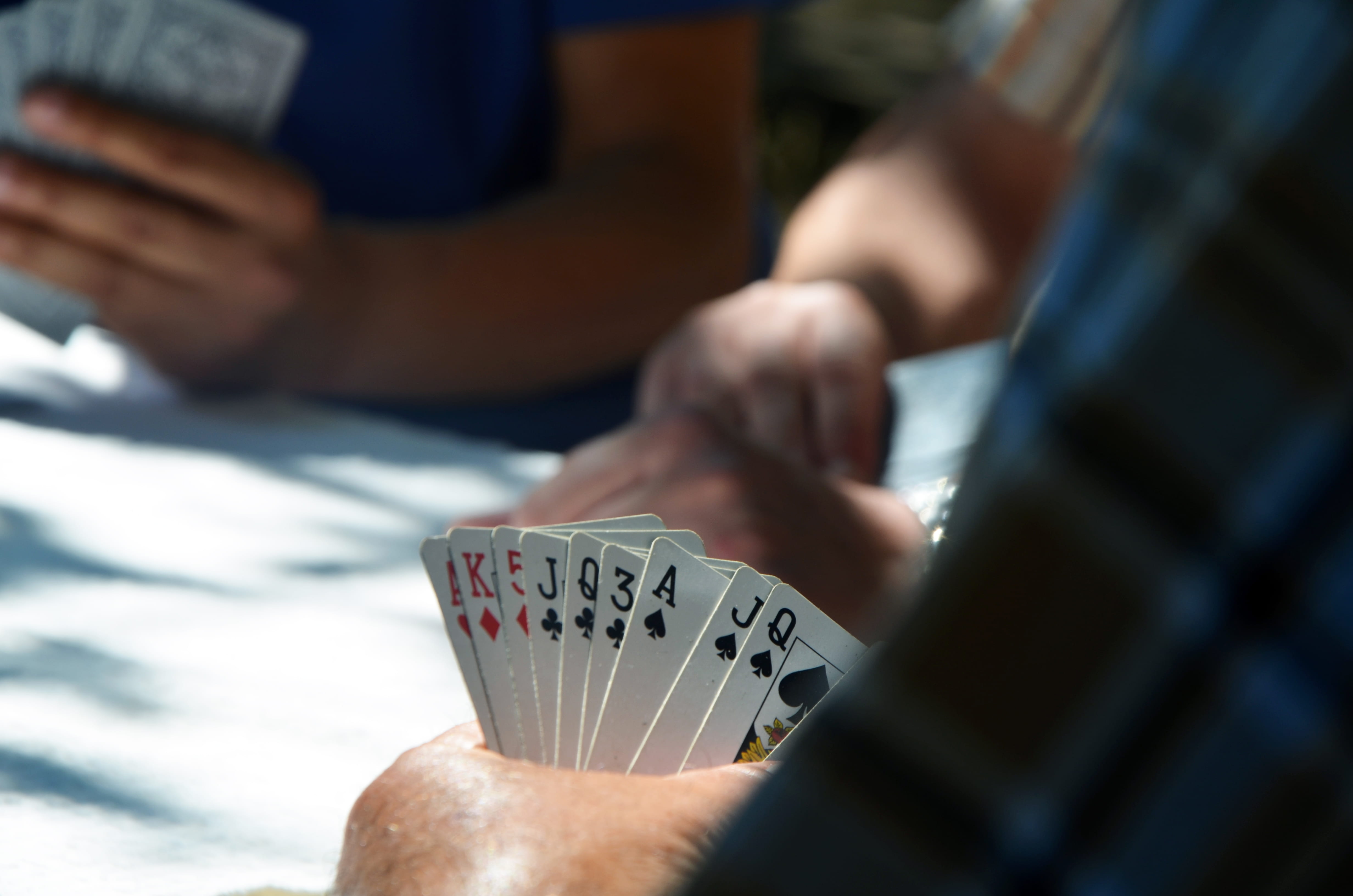 arts culture and entertainment, people, ace, close-up, relaxation, midsection, opportunity, betting, over the shoulder view, pile, left, playing, hand, HD Wallpaper