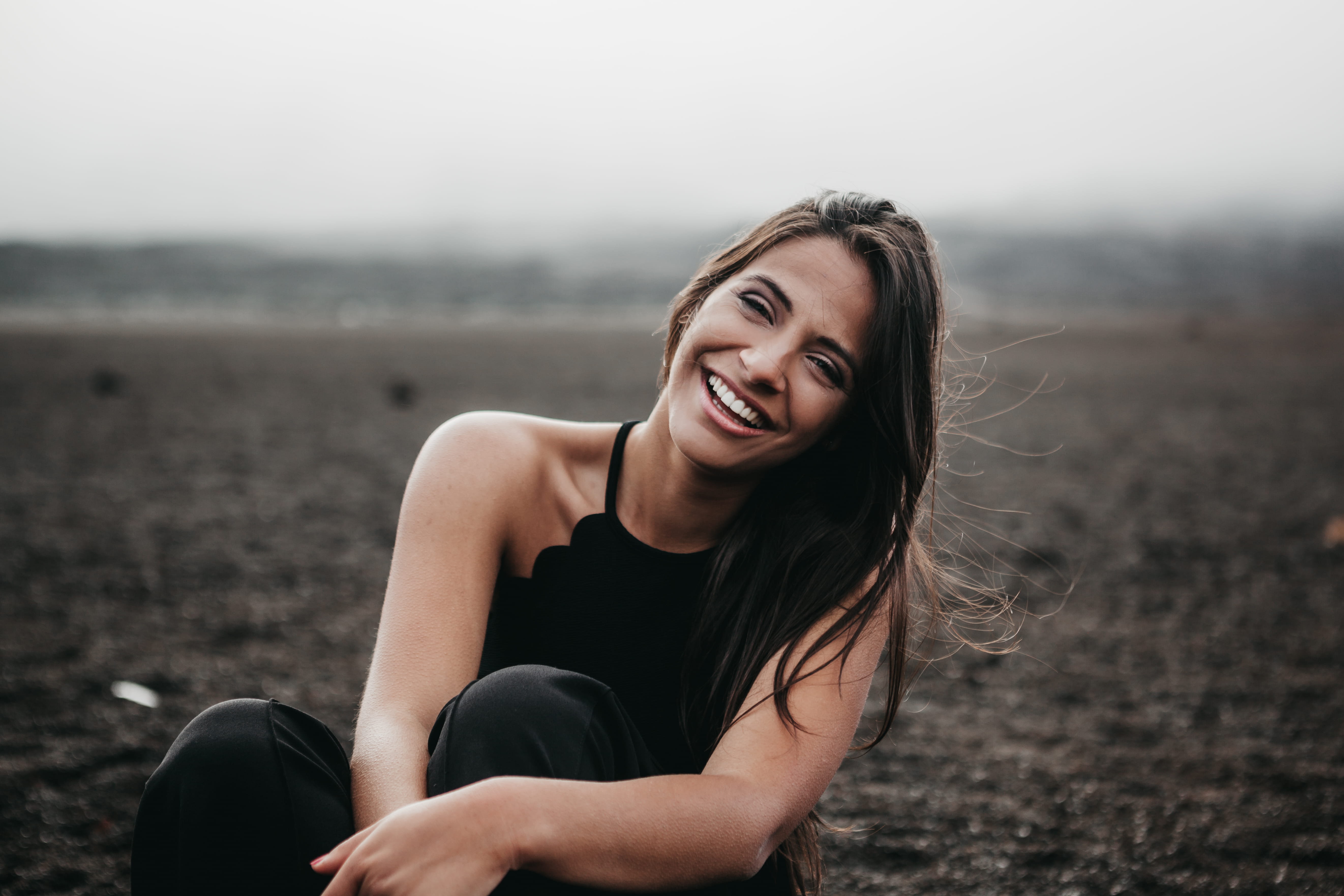 beauty, women, brown hair, smile, classy, ground, headshot, outdoors, land, fashion, 5K, young women, one person, young adult, face, female, outdoor, sitting, HD Wallpaper