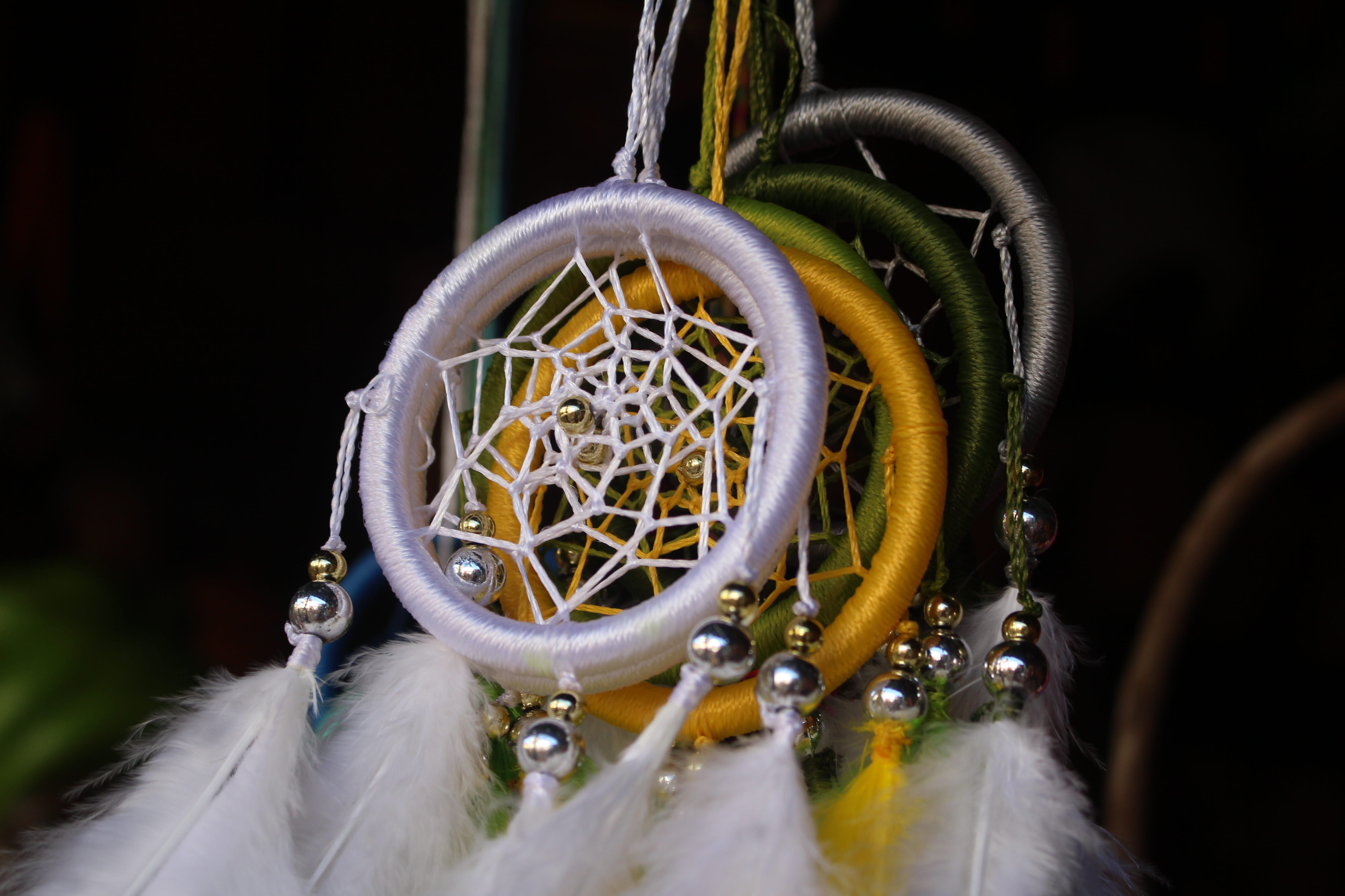 photo, handmade, selective focus, dreamcatcher, water, close, dream, dreamcatchers, circle, symbol, close-up, outdoors, feather, day, geometric shape, protection, HD Wallpaper