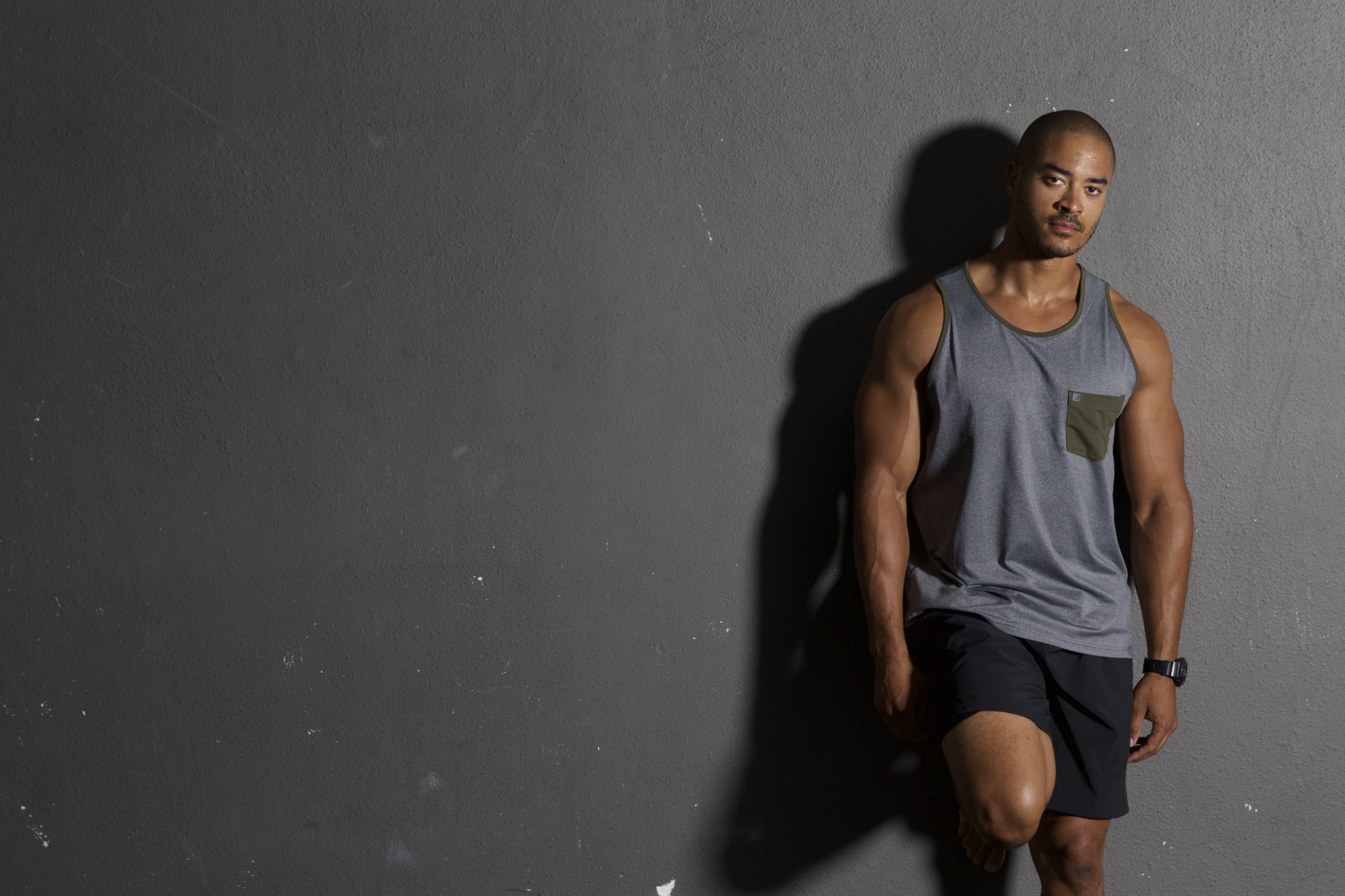 adults only, tank, young men, top, two people, male, person, wall - building feature, men, confident, clothing, one person, front view, shorts, three quarter length, HD Wallpaper