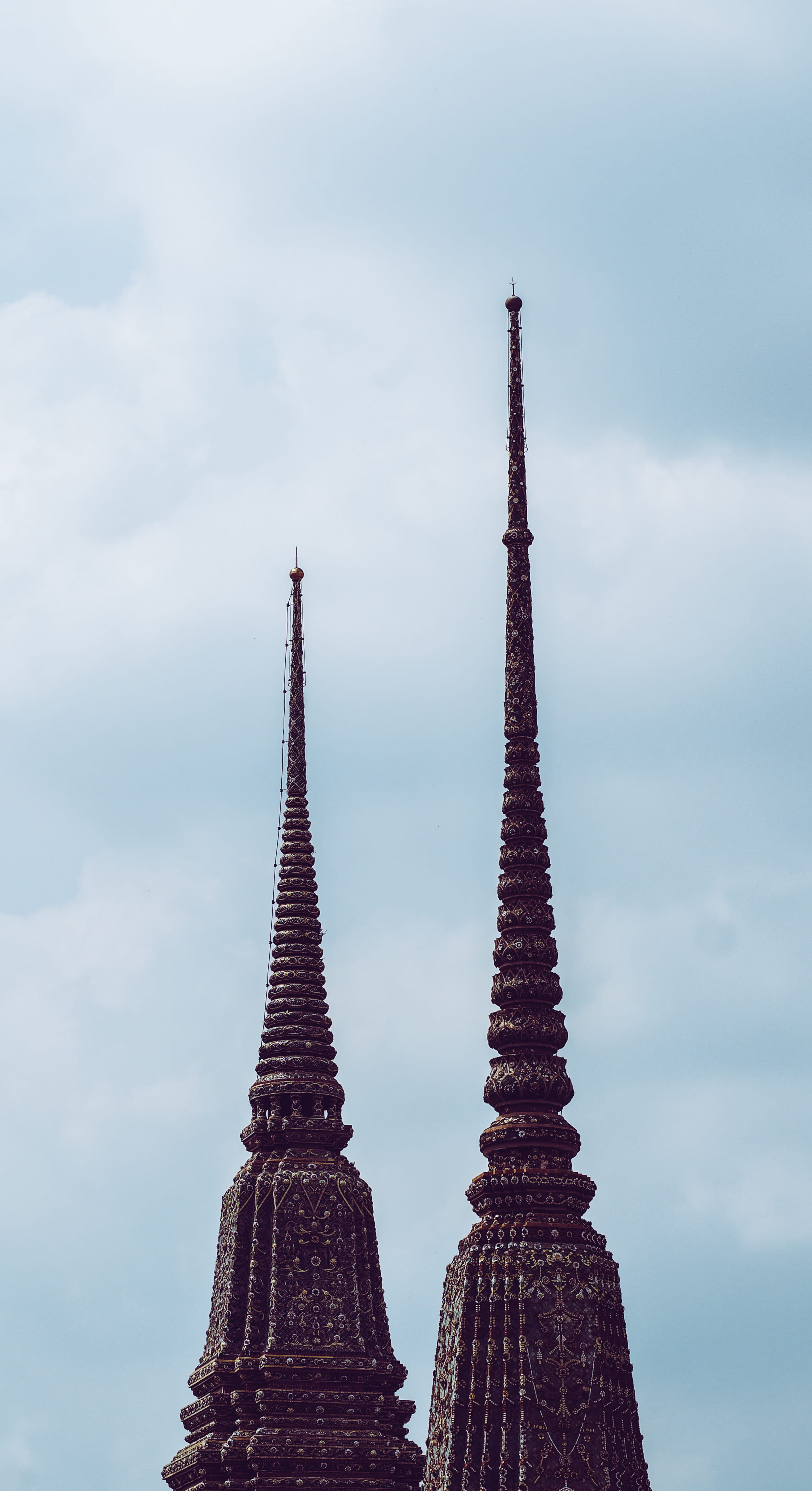 tourism, sky, cloud - sky, history, low angle view, religion, nature, tall - high, spire, temple, built structure, spirituality, outdoors, building, architecture, Phone HD Wallpaper