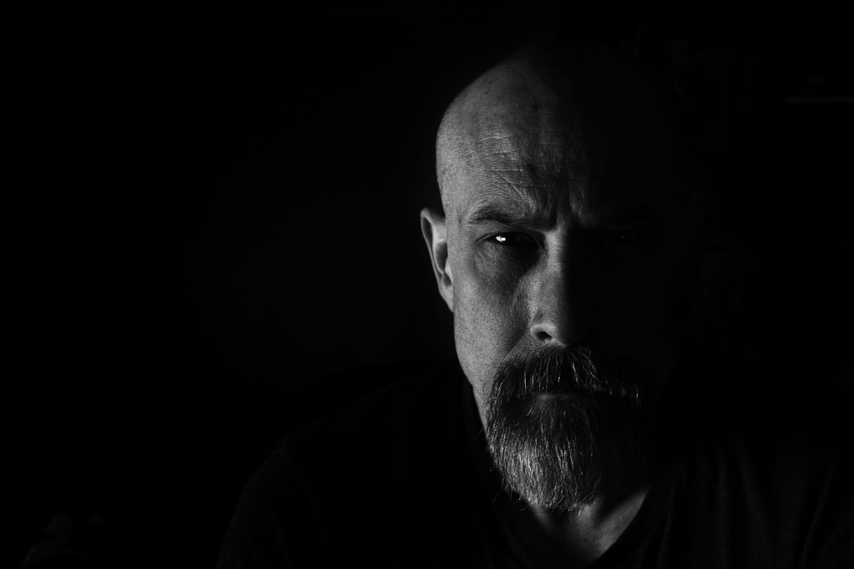 2K, mature men, close-up, black background, contemplation, human face, males, hair loss, portrait, human body part, beard, face, dark, copy space, one person, HD Wallpaper