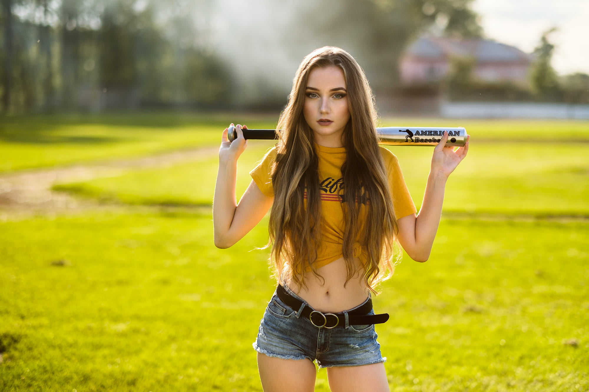 belt, yellow t-shirt, 1080P, belly, jean shorts, women, baseball bat, women outdoors, long hair, grass, HD Wallpaper