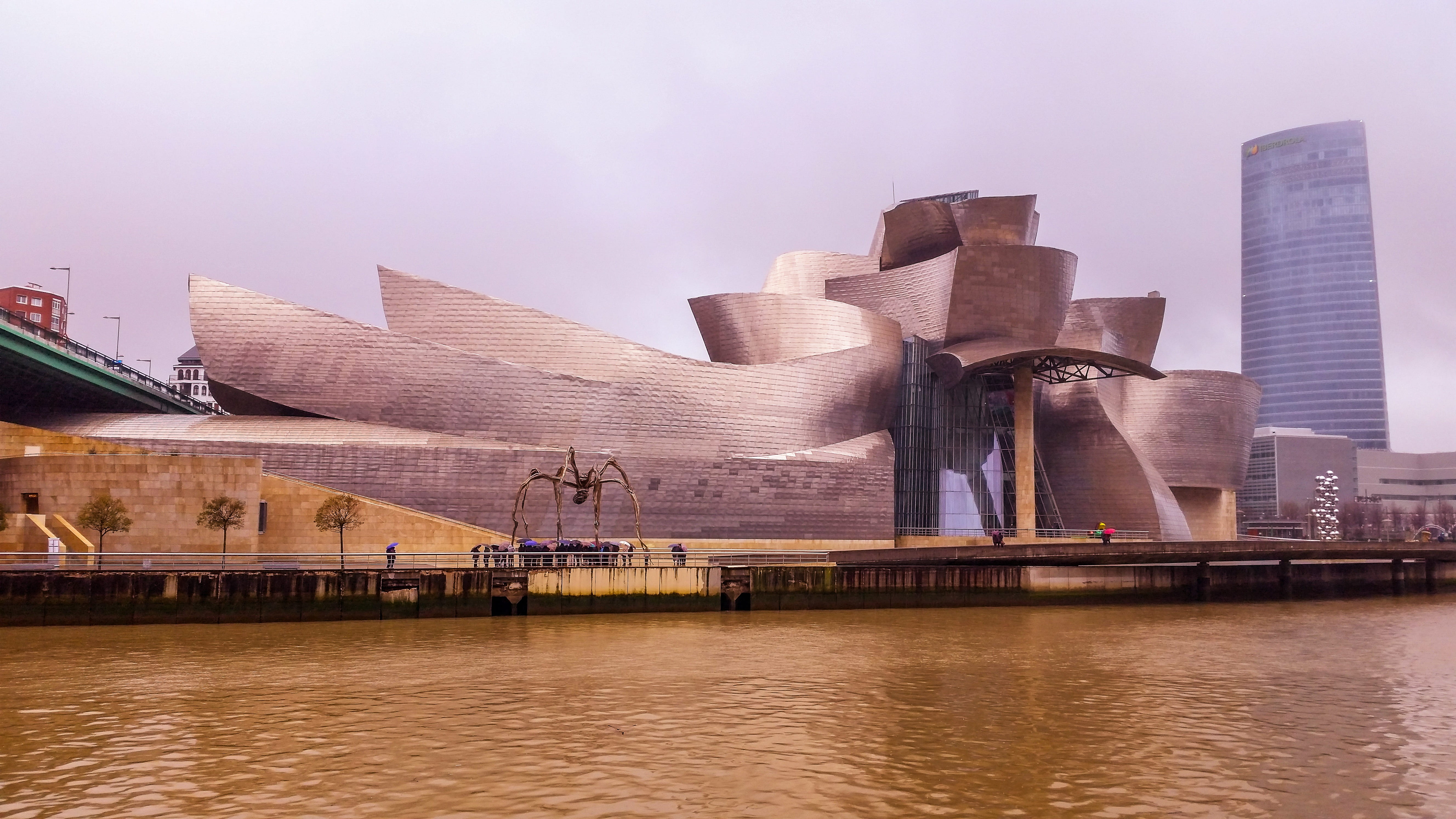 office building exterior, landscape, sky, 5K, no people, built structure, bilbao, guggenheim, river, city, skyscraper, travel destinations, nature, waterfront, HD Wallpaper