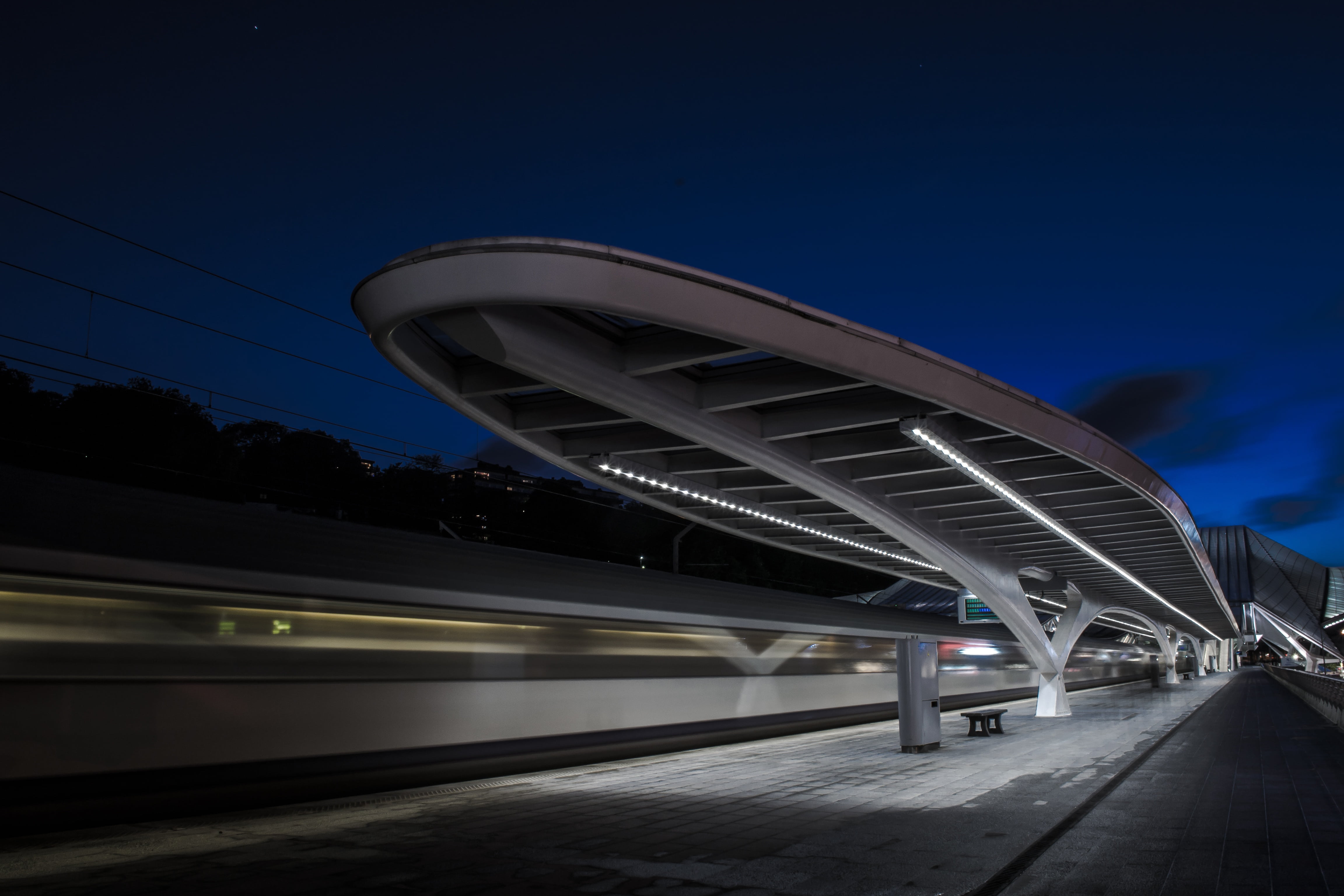 train, blue, connection, illuminated, train - vehicle, architecture, evening, railroad station, gray, city, building exterior, modern, highway, bridge, HD Wallpaper