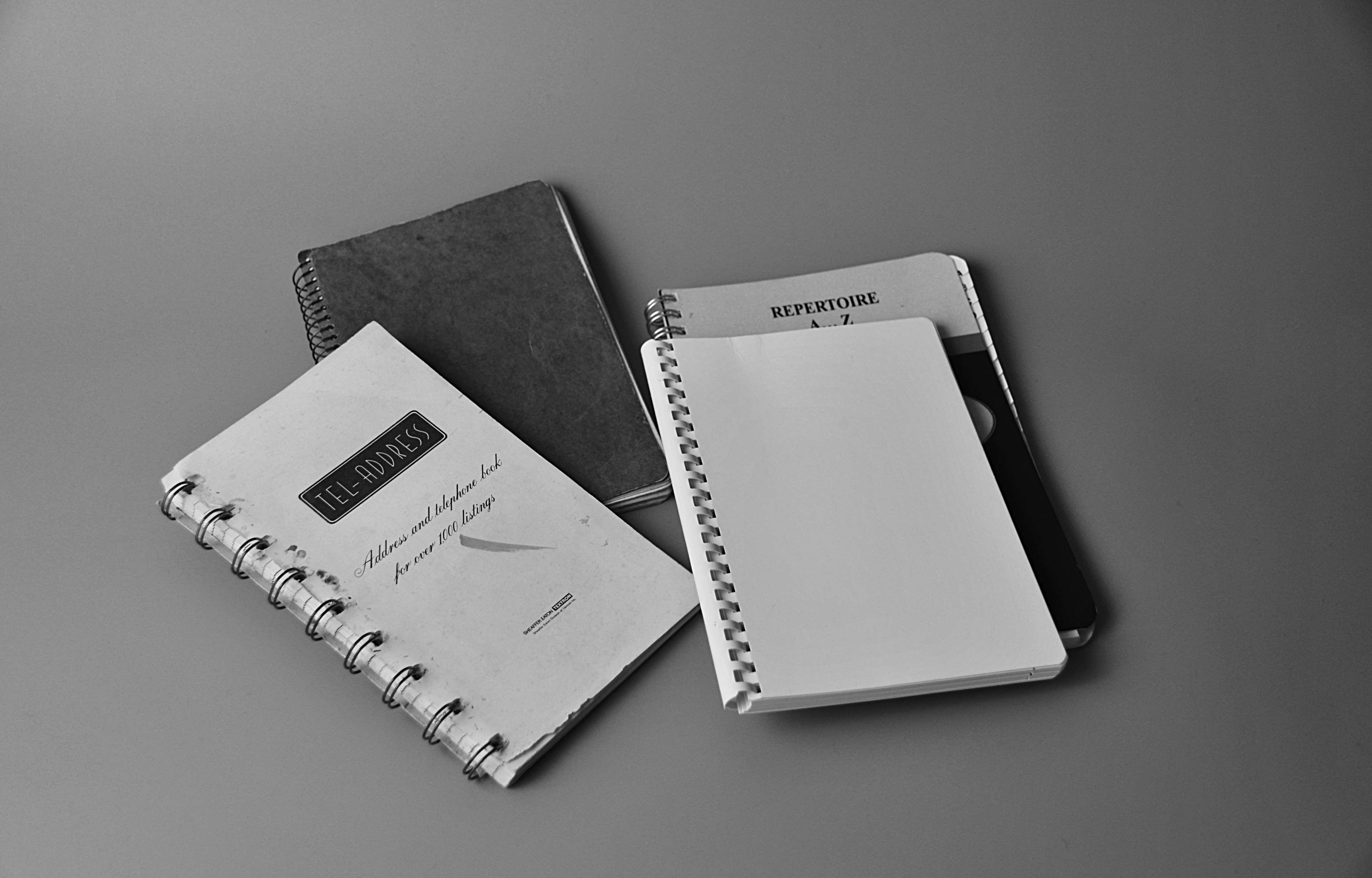 western script, office, telephone book, document, indoors, group of objects, publication, high angle view, note pad, address book, spiral notebook, business finance and industry, HD Wallpaper